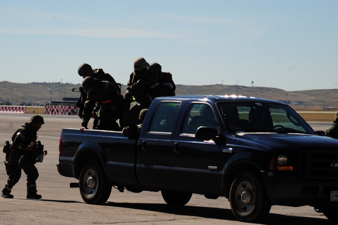 ELLSWORTH AIR FORCE BASE, S.D. –Airmen from the 28th Civil Engineer Squadron get out of a truck after being transported during a Phase II Operational Readiness Exercise, Sept. 16. The exercise tests Airmen and their abilities to operate in a simulated deployed environment. (U.S. Air Force photo/Senior Airman Corey Hook)