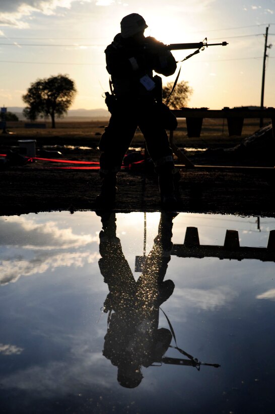 ELLSWORTH AIR FORCE BASE, S.D. – Staff Sgt. Santana Brown, 28th Civil Engineer Squadron structures technician, takes aim during a Phase II Operation Readiness Exercise, Sept. 16. The exercise is a simulated deployment which tests Airmen on their skills and abilities while under stressful conditions. (U.S. Air Force photo/Senior Airman Corey Hook)