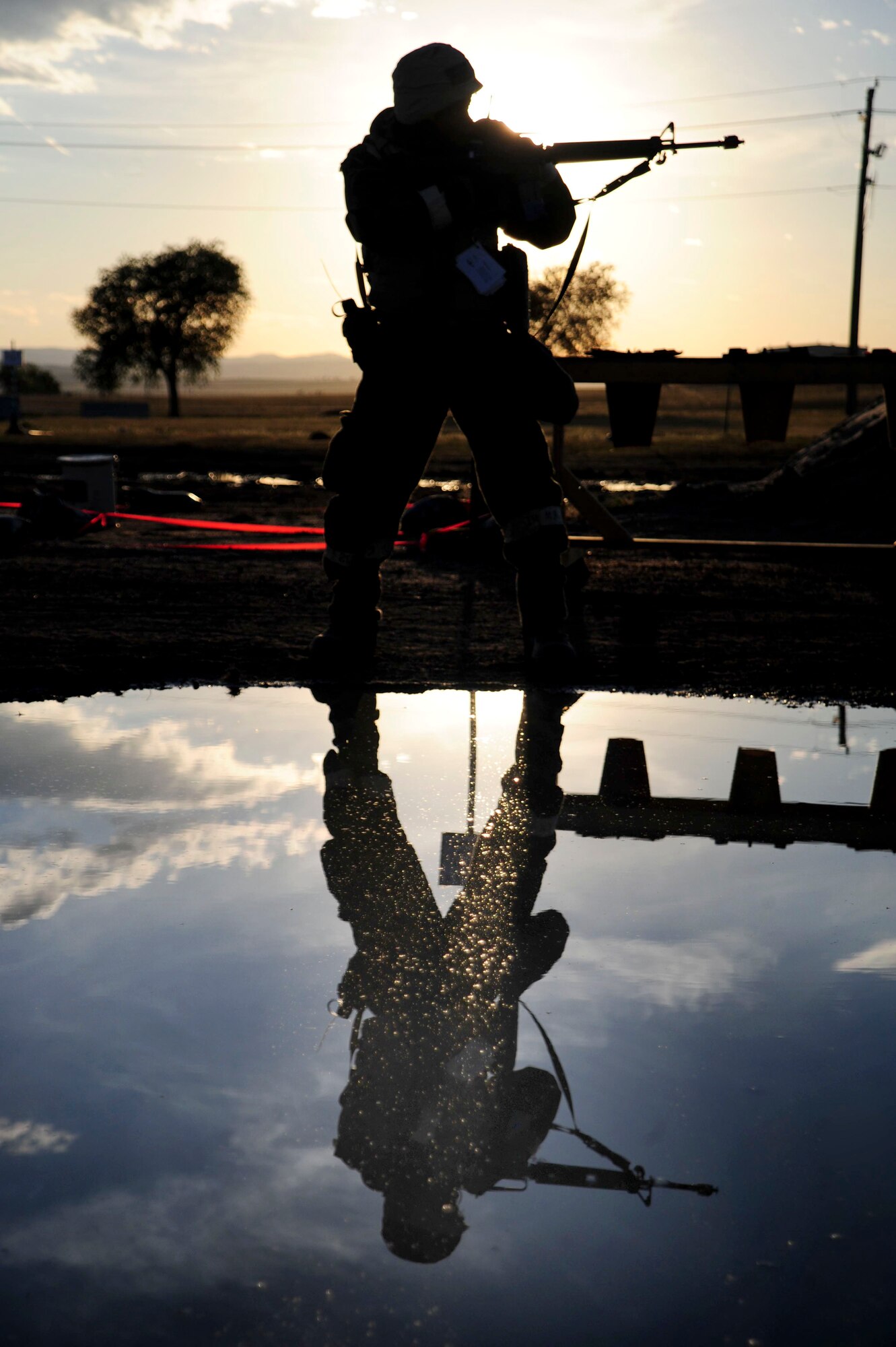 ELLSWORTH AIR FORCE BASE, S.D. – Staff Sgt. Santana Brown, 28th Civil Engineer Squadron structures technician, takes aim during a Phase II Operation Readiness Exercise, Sept. 16. The exercise is a simulated deployment which tests Airmen on their skills and abilities while under stressful conditions. (U.S. Air Force photo/Senior Airman Corey Hook)