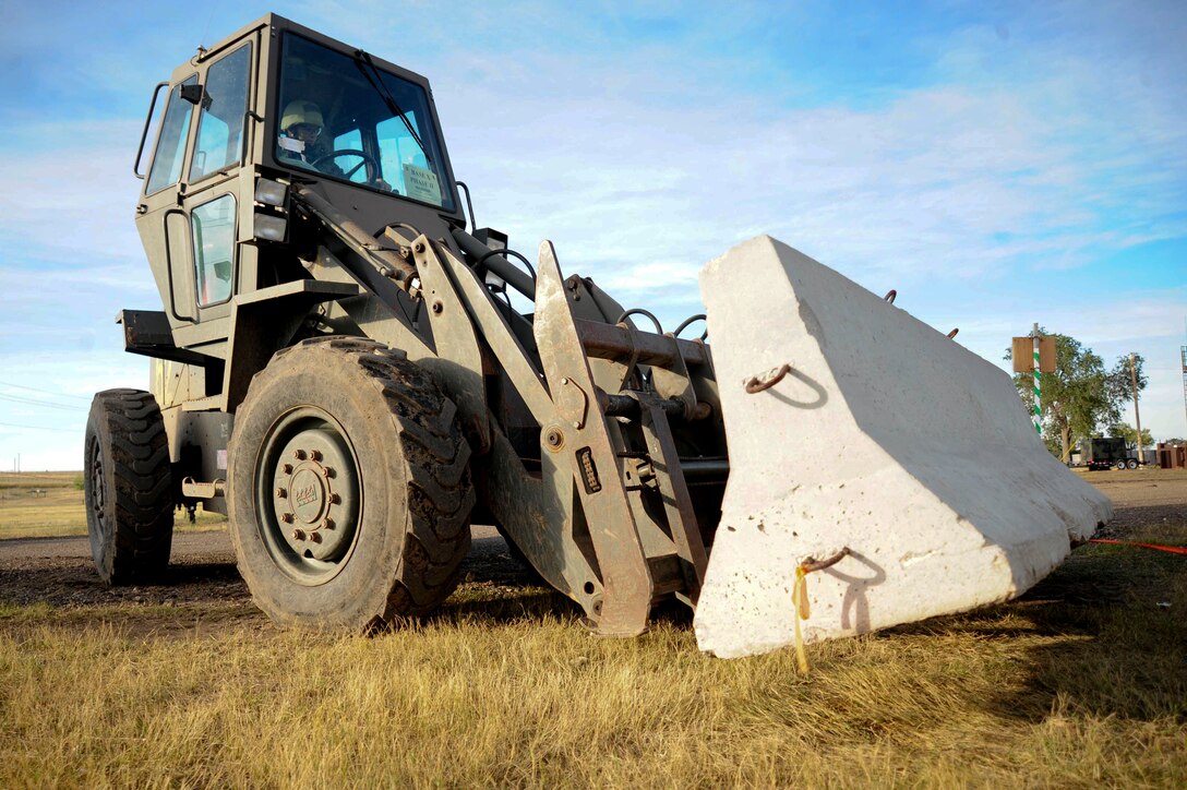 ELLSWORTH AIR FORCE BASE, S.D. – Staff Sgt. Zachary Carey, 28th Civil Engineer Squadron water fuel systems craftsman, operates a forklift to move a barrier during a Phase II Operational Readiness Exercise, Sept. 16. Airmen use the barriers for cover during simulated-ground attacks. (U.S. Air Force photo/Senior Airman Corey Hook)