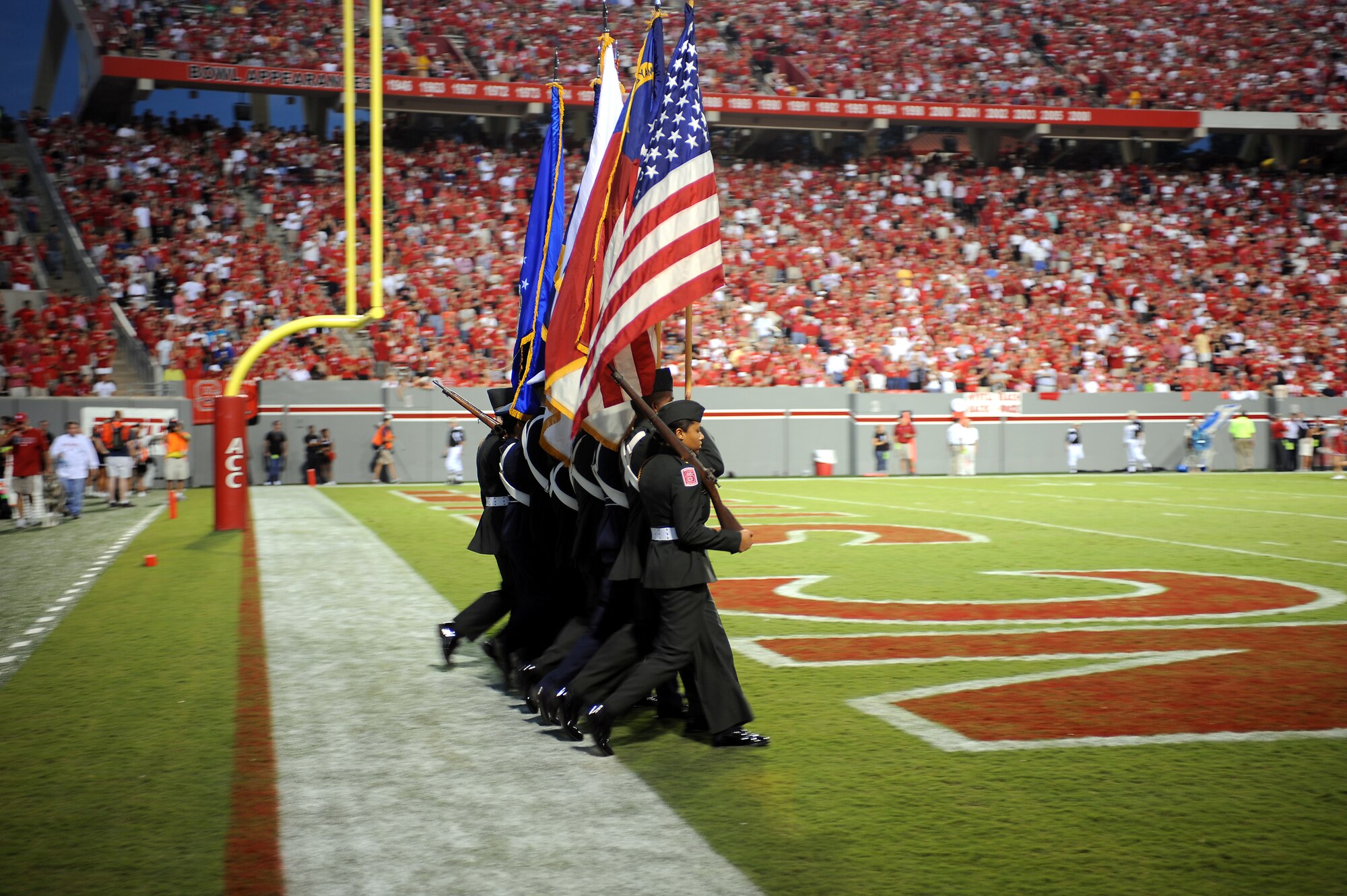 RALEIGH, N.C. – ROTC cadets from the N.C. State Color Guard post the colors prior to the opening ceremony at Carter-Finley Stadium in Raleigh Sept. 16, 2010. During the Military Appreciation Day football game against the Cincinnati Bearcats, the Seymour Johnson Air Force Base 333rd Fighter Squadron performed a flyover, and the U.S. Army Fort Bragg paratroopers dropped to the field at half-time. (U.S. Air Force photo/Master Sgt. Brandt Smith)