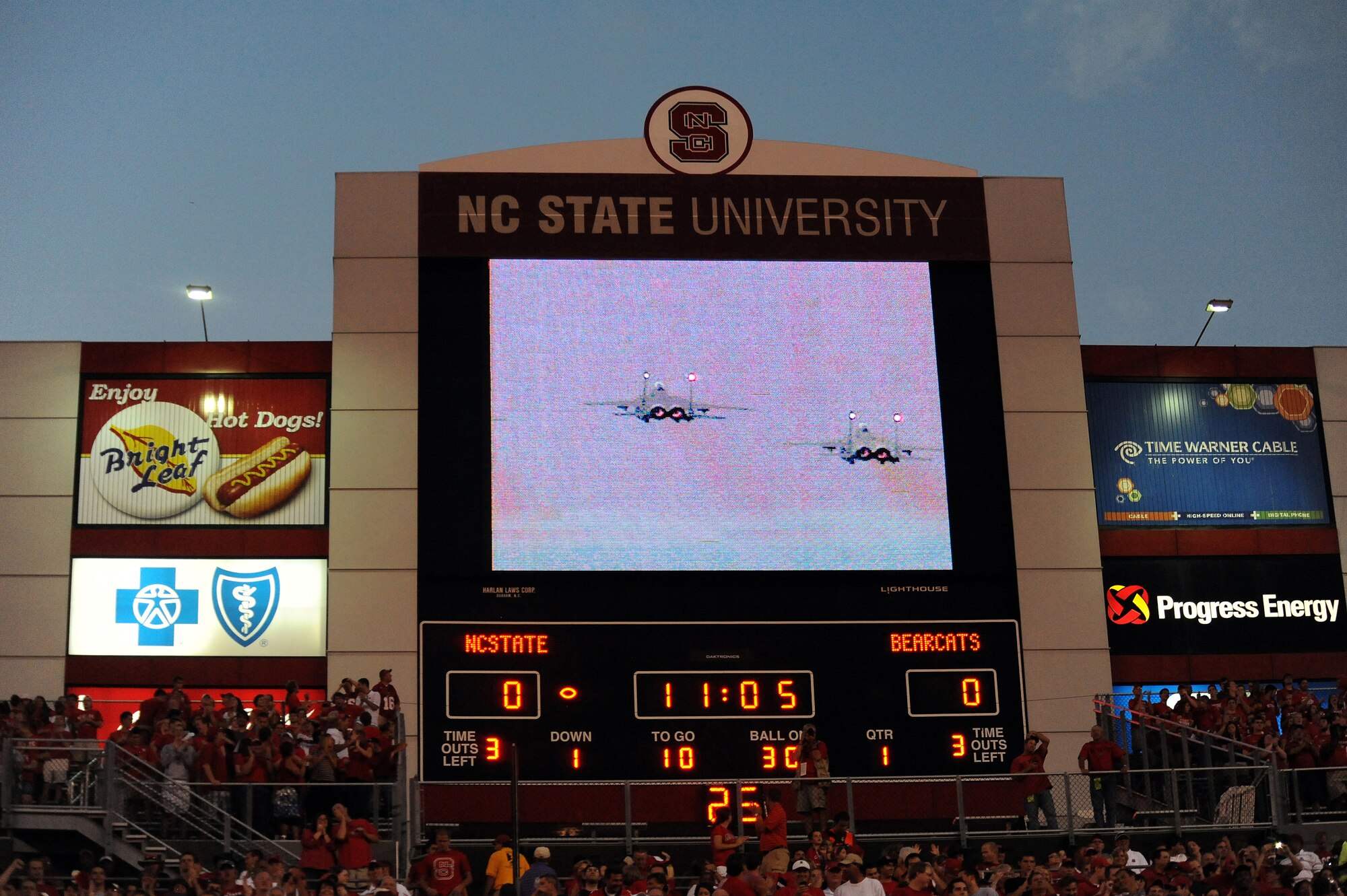 RALEIGH, N.C. – Fans watch a jumbotron as F-15E Strike Eagles from the 333rd Fighter Squadron at Seymour Johnson Air Force Base flyover the Carter-Finley Stadium Sept. 16, 2010. The jets performed a fly-by after opening ceremonies as part of the Military Appreciation Day festivities. (U.S. Air Force photo/Master Sgt. Brandt Smith)