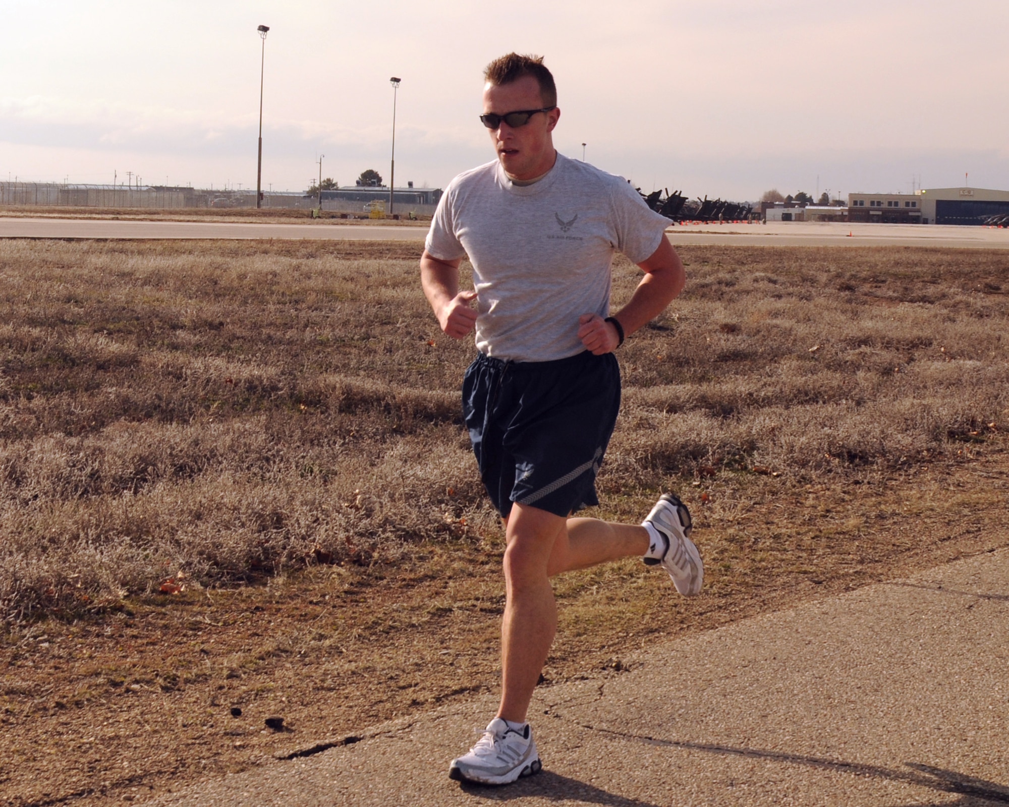 Staff Sgt. Josh Williams, a military pay technician for the 124th Fighter Wing finance section, completes the 1.5 mile run portion of his fitness test. (Air Force photo by Staff Sgt. Heather Walsh)(Released)