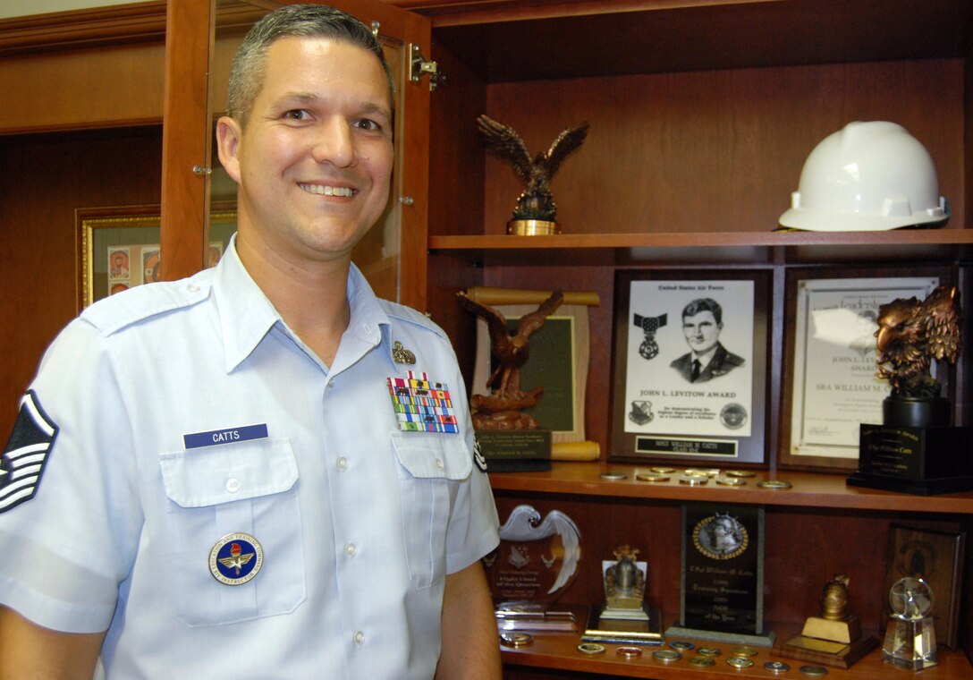 Master Sgt. William Catts, 364th Training Squadron flight chief of telecommunications flight, poses next to the trophy case in his office at Sheppard Air Force Base, Texas.  Sergeant Catts recently returned from the Senior NCO Academy where he earned his third John Levitow Award.  He earned the award during Airman Leadership School and the NCO Academy.  (U.S. Air Force photo/Tech. Sgt. Vernon Cunningham)