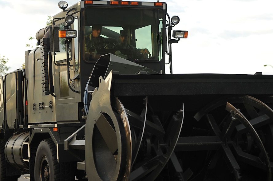 Chief Master Sgt. David Carlson, 319th Air Refueling Wing command chief, drives a piece of snow removal equipment during the 319th Air Refueling Wing Snow Parade on Sept. 22, 2010, at Grand Forks Air Force Base, N.D. The parade allows base personnel to see the snow removal equipment before the first snow fall. (U.S. Air Force Photo/Senior Airman Amanda N. Stencil) 
