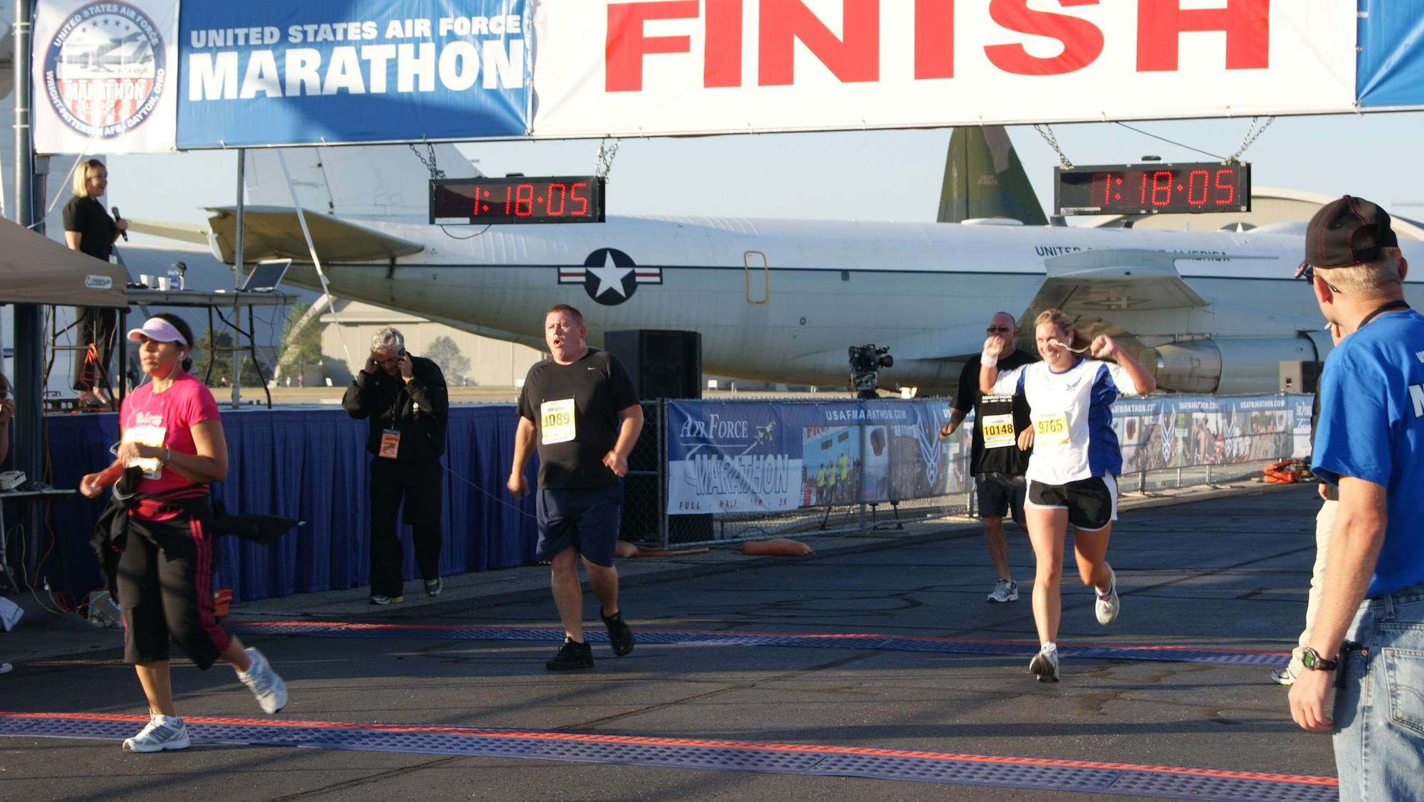 Maj. Shannon Mann, 916th Public Affairs, crosses the USAF Marathon 10K finish line with a chip time of 56 minutes. (USAF photo by MSgt. Wendy Lopedote)