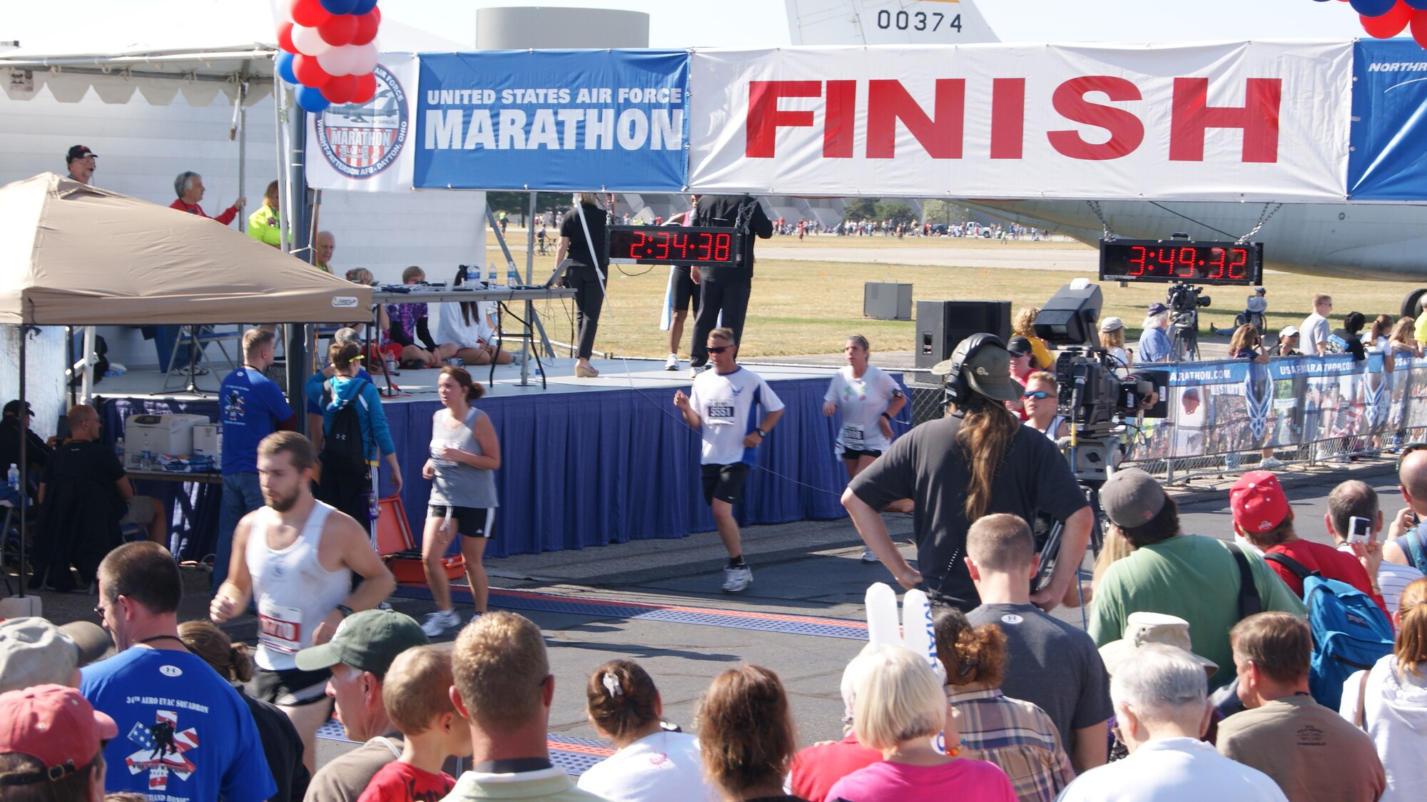 Chief Master Sgt. Jeff Jarvis, 567th RED HORSE, crosses the finish line at the USAF  Half Marathon with a chip time of 2:34. (USAF photo by MSgt. Wendy Lopedote, 916ARW/PA)