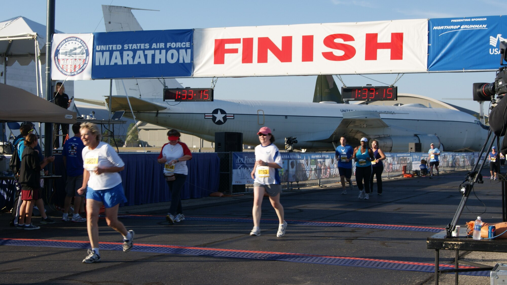 Master. Sgt. Gillian Albro, 916th Mission Support Flight first sergeant, crosses the finish line with a chip time of 1:11 at the Air Force Marathon 10K. (USAF photo by MSgt. Wendy Lopedote, 916ARW/PA)