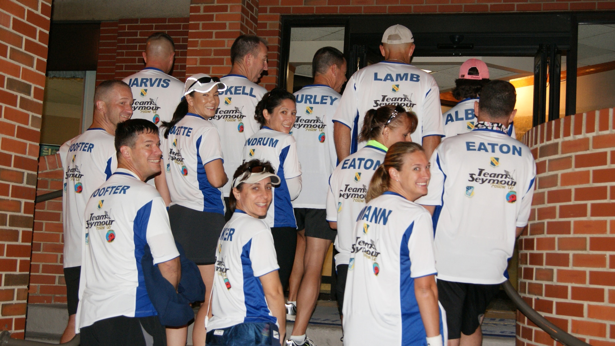 Yep, we're all here! Team Seymour runners show off the backs of their shirts prior to the Air Force Marathon on Sept. 18. (USAF photo by MSgt. Wendy Lopedote, 916ARW/PA)