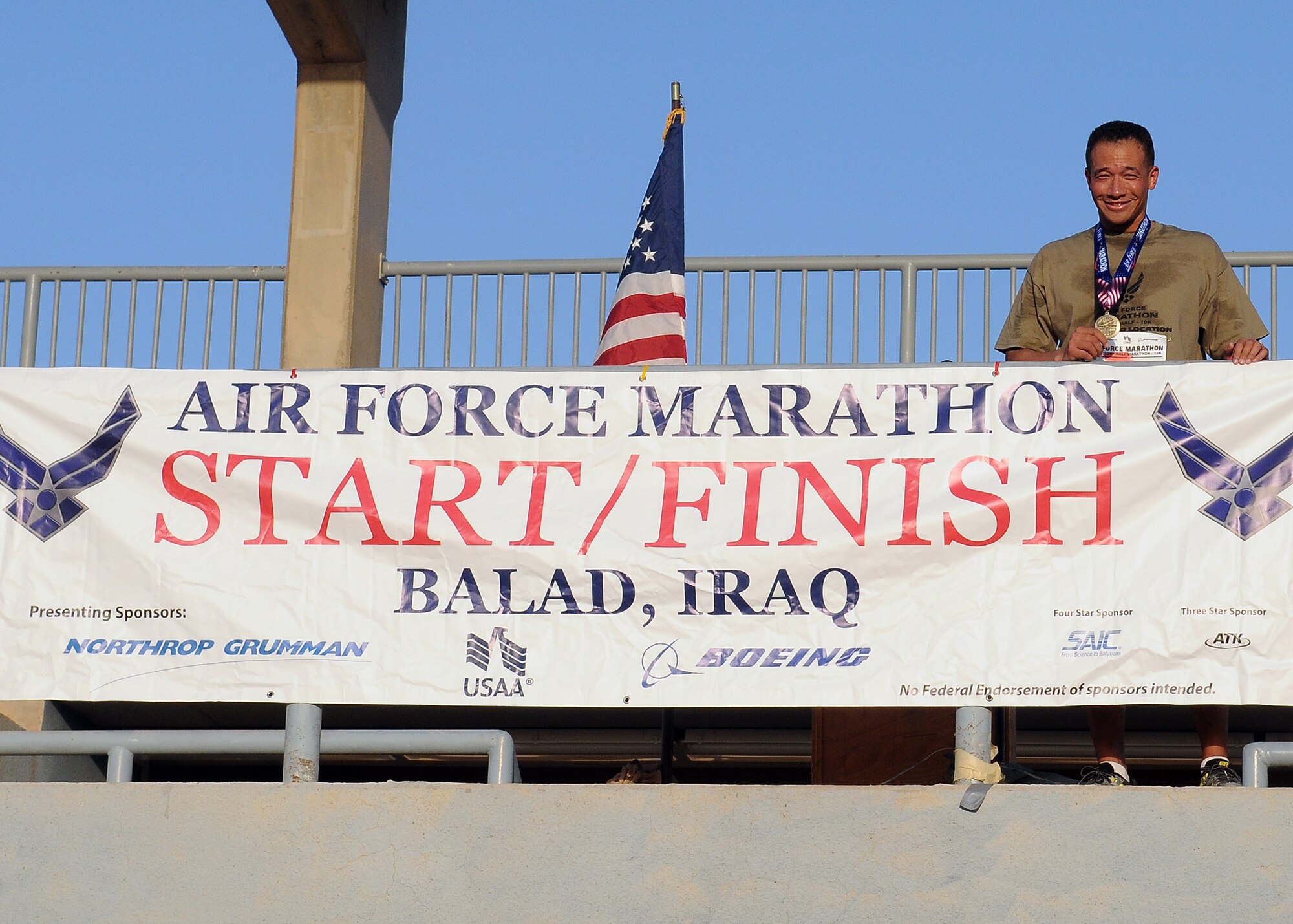 Lt. Col. Art Primas, former deputy of operations for the 911th Air Refueling Squadron, shows that the Air Force Marathon wasn't just happening in Dayton, Ohio. Runners across the globe participated in the week leading up to the Dayton race. (USAF courtesy photo)