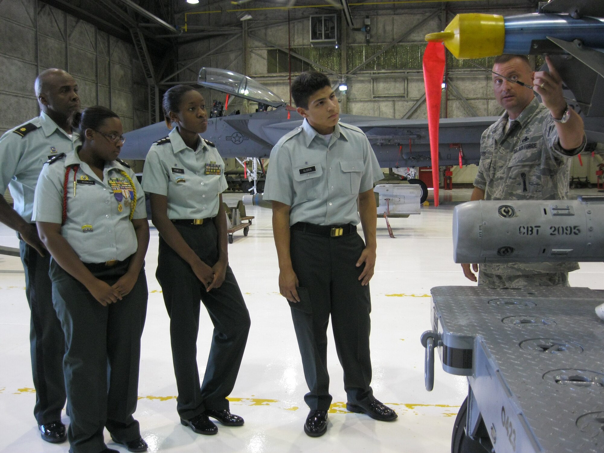 SEYMOUR JOHNSON AIR FORCE BASE, N.C. – Army Maj. Melvin Davis, Cadet Commander T’Keyah Perkins, Cadet Capt. Tierra Powell and Cadet Jose Gloria are a few of the Army JROTC students from North Edgecombe County High School visiting Seymour Johnson Air Force base as part of their class field trip.  Master Sgt. Marvin Glass shows the CAP-9 air-to-air heat-seeking missile carried by the F-15E Strike Eagle.  Sergeant Glass is a weapons crew leader at the weapons load training facility and hails from New Virginia, Iowa. (U.S. Air Force photo/Robin DeMark)