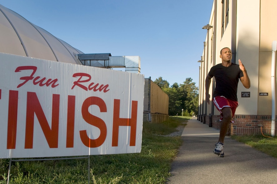 HANSCOM AIR FORCE BASE, Mass. – Capt. Albert Squire finishes the Hanscom Back to School 5K Fun Run at the Hanscom Fitness Center on Sept. 15. Captain Squire, who works for the Cyber/NetCentric Directorate, was the overall top finisher for the fun run with a time of 20:38. (U.S. Air Force photo by Mark Wyatt)