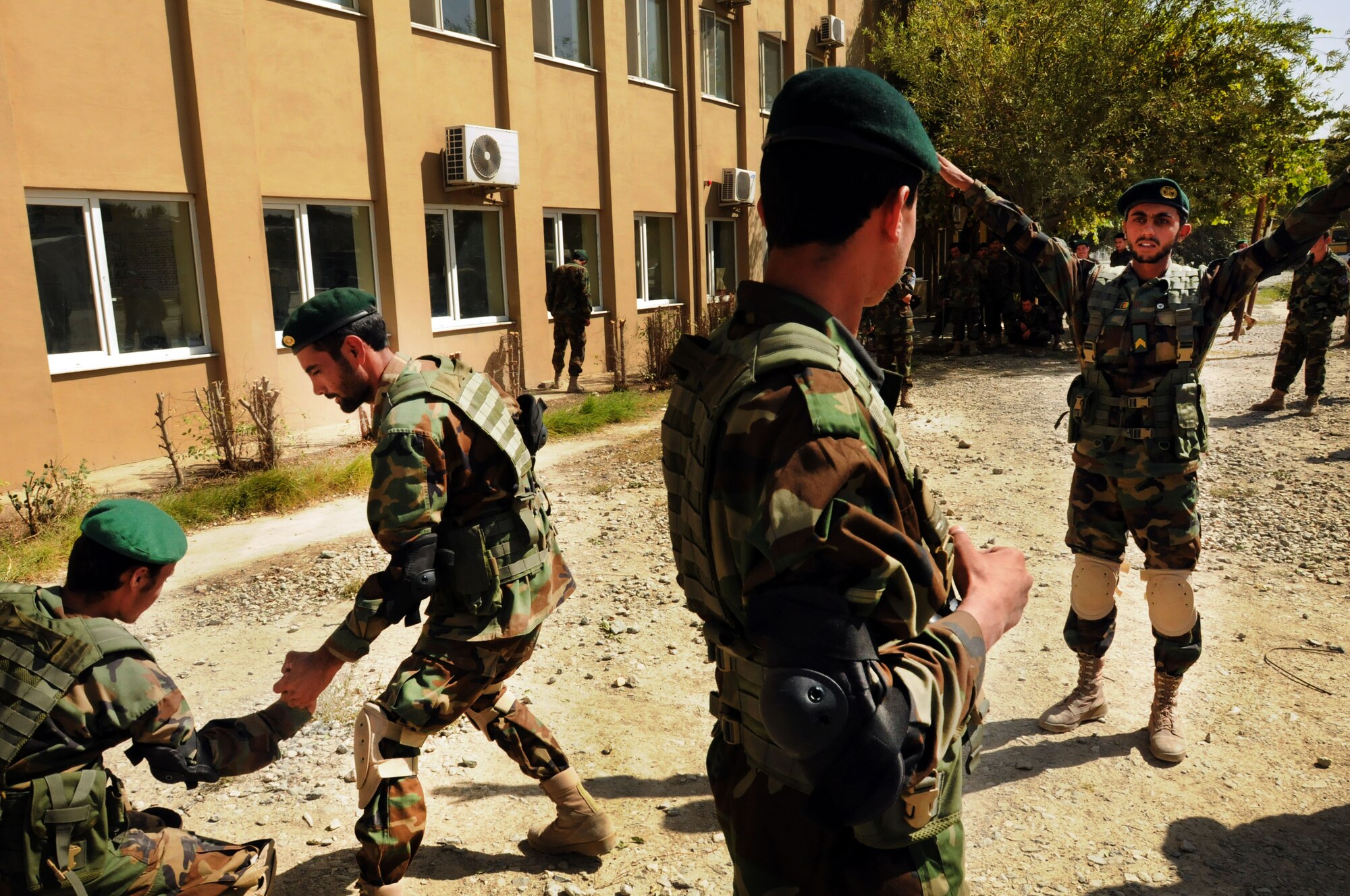 100923-N-6031Q-006 KABUL, Afghanistan - Security Forces students of the Pohantoon-e-Hawayee Afghan Air Force training school practices unarmed take-downs and control method during an "open house" on Sep. 23, 2010 in which military officials were able to tour the school, peak in on courses being conducted, and were briefed on the achievements of the school over the last year. (US Navy photo by Mass Communication Specialist 2nd Class David Quillen/ RELEASED).