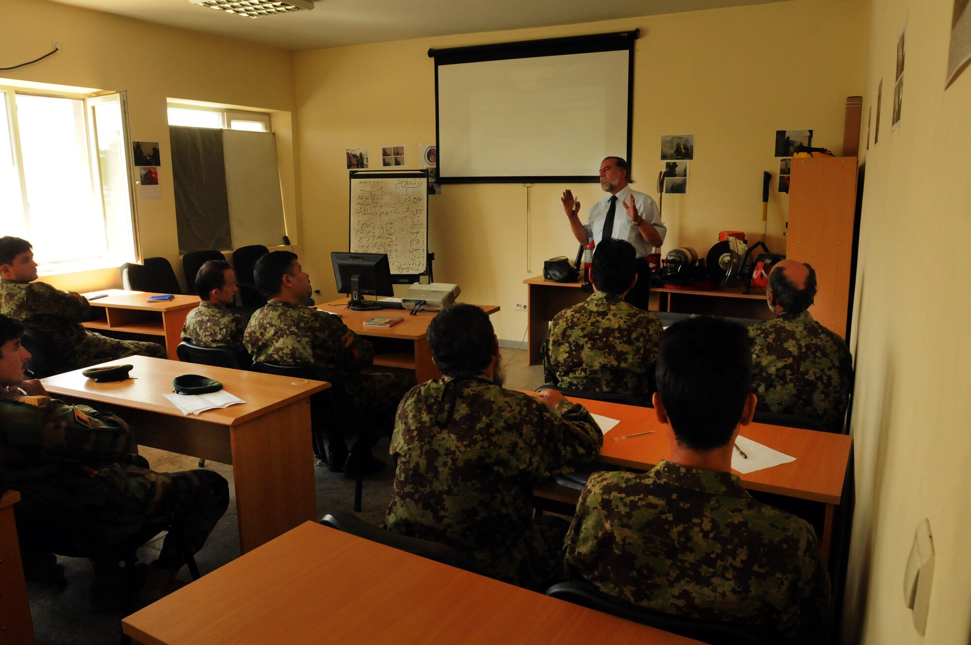 100923-N-6031Q-005 KABUL, Afghanistan - Students of the Pohantoon-e-Hawayee Afghan Air Force training school sit through a lecture. The Pohantoon-e-Hawayee Afghan Air Force training school conducted an "open house" on Sep. 23, 2010 in which military officials were able to tour the school, peak in on courses being conducted, and were briefed on the achievements of the school over the last year. (US Navy photo by Mass Communication Specialist 2nd Class David Quillen/ RELEASED).