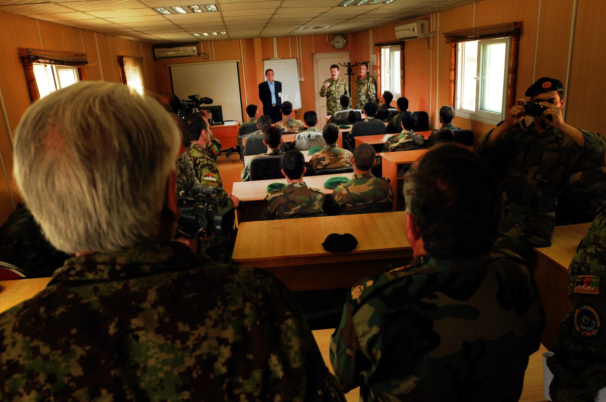 100923-N-6031Q-004 KABUL, Afghanistan - Gen. Muhammad Dawran, Commanding General, Kabul Air Wing, gives a brief lecture to students of the Pohantoon-e-Hawayee Afghan Air Force training school during an "open house" on Sep. 23, 2010 in which military officials were able to tour the school, peak in on courses being conducted, and were briefed on the achievements of the school over the last year. (US Navy photo by Mass Communication Specialist 2nd Class David Quillen/ RELEASED).