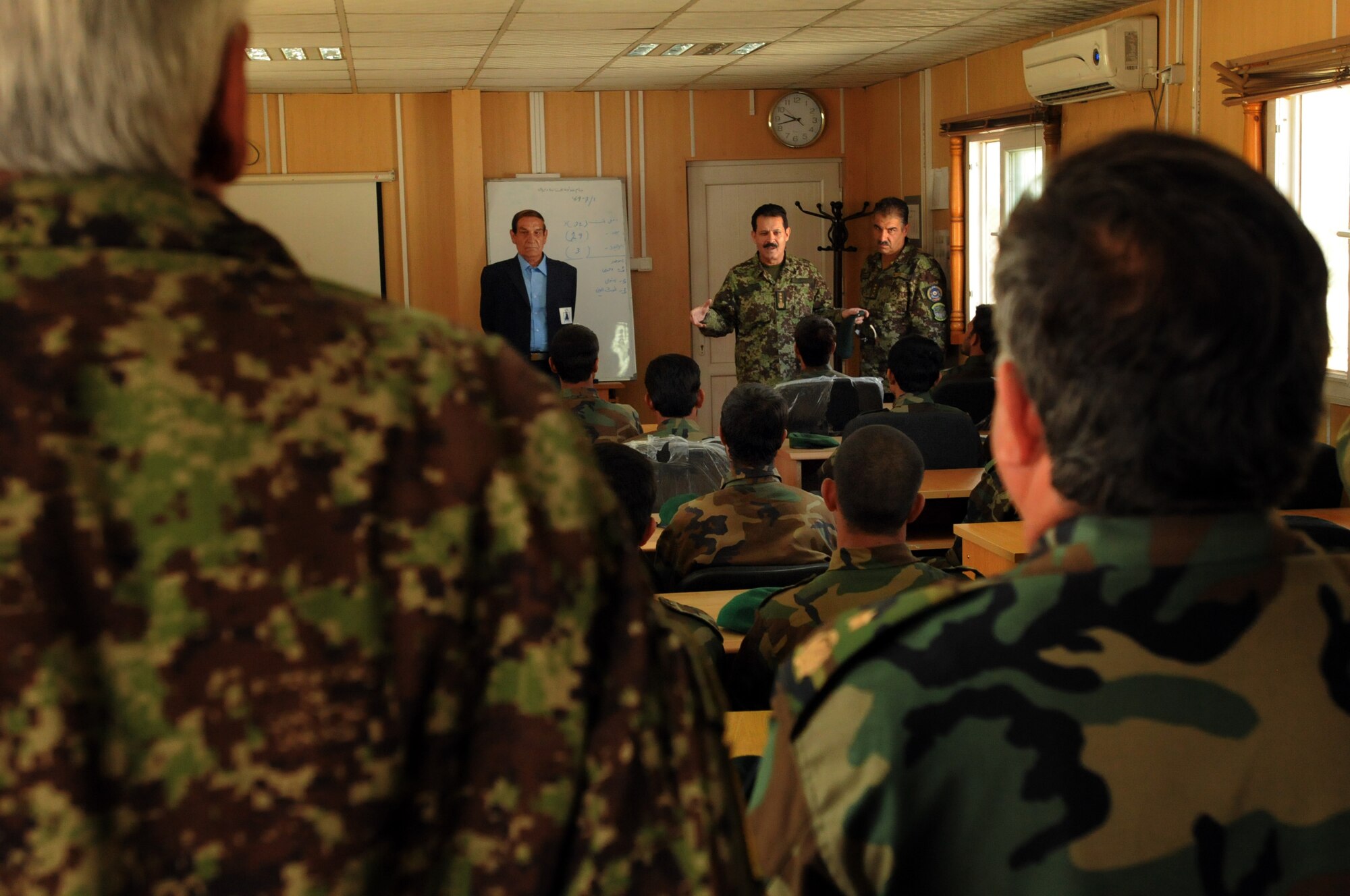 100923-N-6031Q-003 KABUL, Afghanistan - Gen. Muhammad Dawran, Commanding General, Kabul Air Wing, gives a brief lecture to students of the Pohantoon-e-Hawayee Afghan Air Force training school during an "open house" on Sep. 23, 2010 in which military officials were able to tour the school, peak in on courses being conducted, and were briefed on the achievements of the school over the last year. (US Navy photo by Mass Communication Specialist 2nd Class David Quillen/ RELEASED).