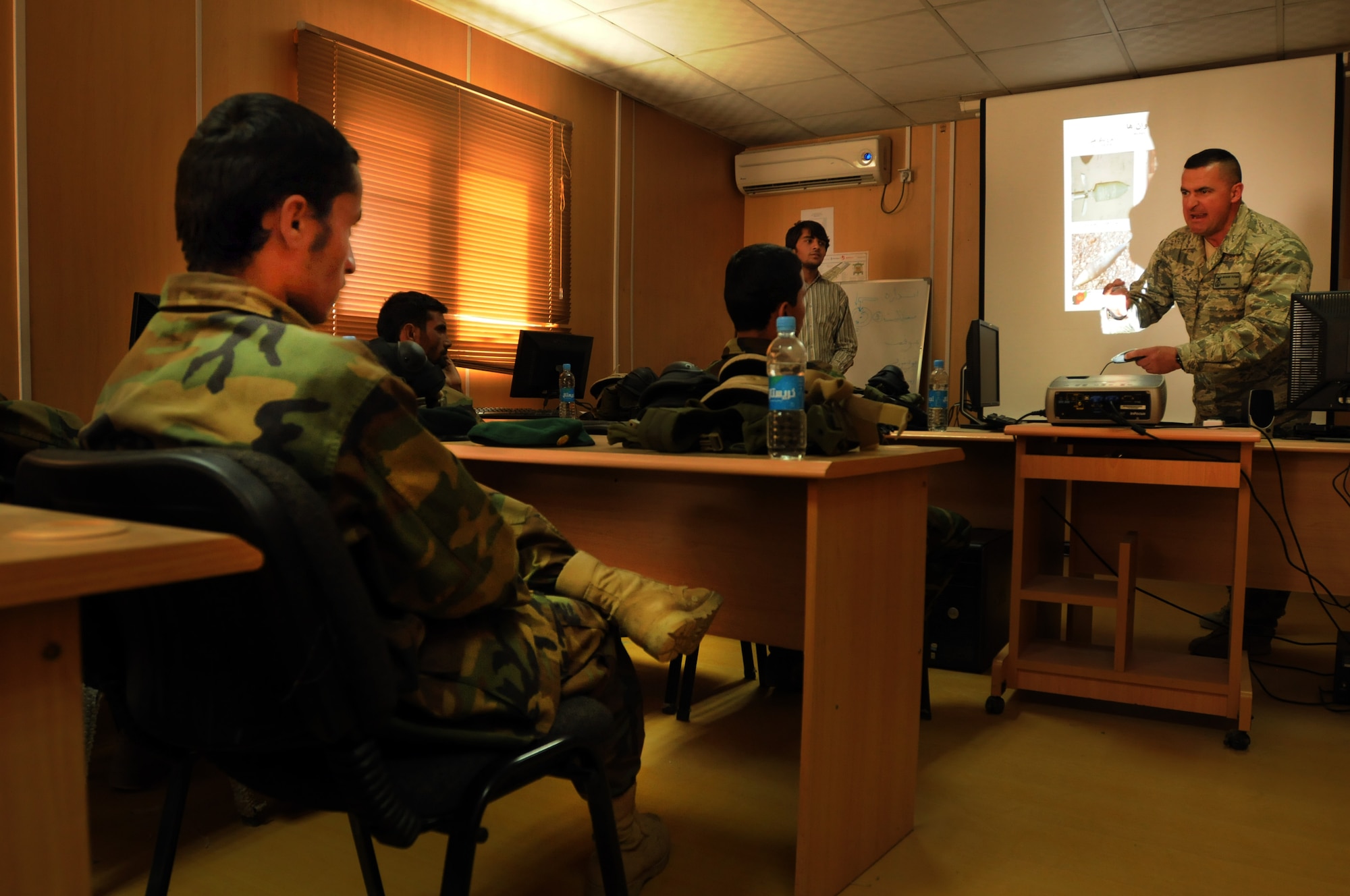 100923-N-6031Q-001 KABUL, Afghanistan - Master Sergeant Richard Putman, 438th Air Expeditionary Advisory Group, NATO Air Training Command- Afghanistan, delivers a thorough lecture on Improvised Explosive Devices to the newest Security Forces class at thePohantoon-e-Hawayee Afghan Air Force training school. The Pohantoon-e-Hawayee Afghan Air Force training school conducted an "open house" on Sep. 23, 2010 in which military officials were able to tour the school, peak in on courses being conducted, and were briefed on the achievements of the school over the last year. (US Navy photo by Mass Communication Specialist 2nd Class David Quillen/ RELEASED).