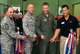 KUNSAN AIR BASE, Republic of Korea -- Col. John Dolan, 8th Fighter Wing commander, cuts the ribbon with base leadership for the brand new CrossFit/Total Resistance Exercise workout room at the base gym Sept. 21.  Both workouts are built to strengthen the entire body and can last anywhere from 15 to 30 minutes. (U.S. Air Force photo/Staff Sgt. Jonathan Pomeroy)