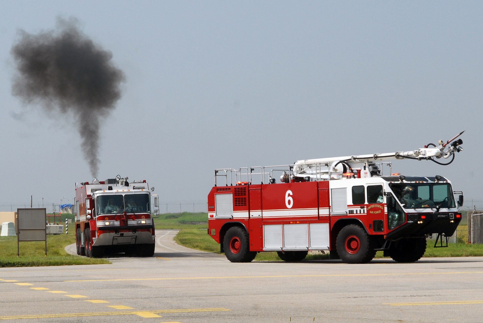 KUNSAN AIR BASE, Republic of Korea -- The 8th Civil Engineer Squadron and Republic of Korea fire departments respond to a simulated hostage exercise at the Gunsan airport here Sept. 17, 2010. The exercise is done annually to enhance counter-terrorism and prepare emergency responders for real life situations. (U.S. Air Force photo/Senior Airman Ciara Wymbs)  