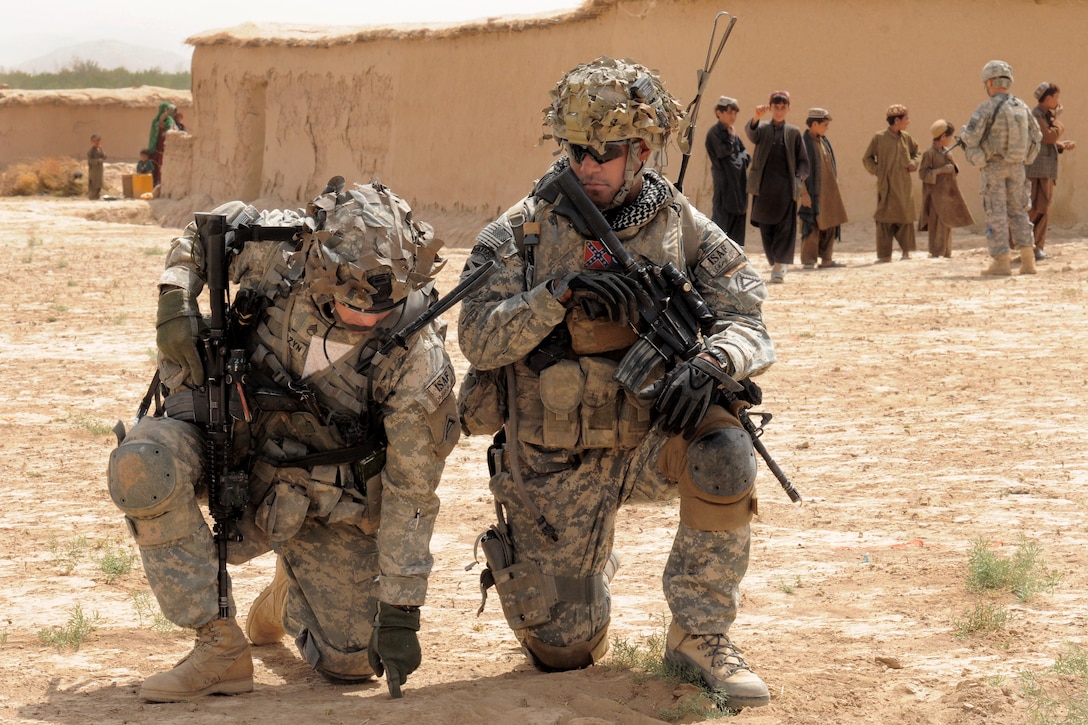 U.S. Army soldiers plan their next move during a presence patrol in Zabul province, Afghanistan, Sept. 19, 2010. The soldiers are assigned to the 1st Battalion, 4th Infantry Regiment.