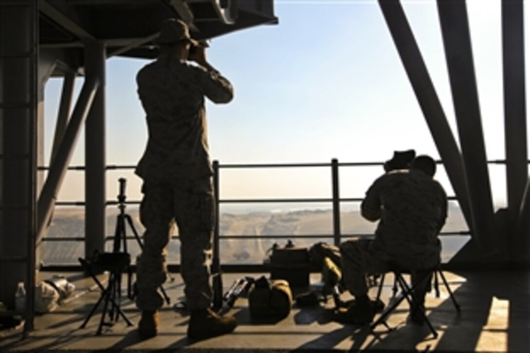 U.S Marine snipers provide overwatch as the USS Kearsarge travels through the Suez Canal in Egypt, Sept. 16, 2010. The Marines are assigned to the Battalion Landing Team, 3rd Battalion, 8th Marine Regiment, 26th Marine Expeditionary Unit.