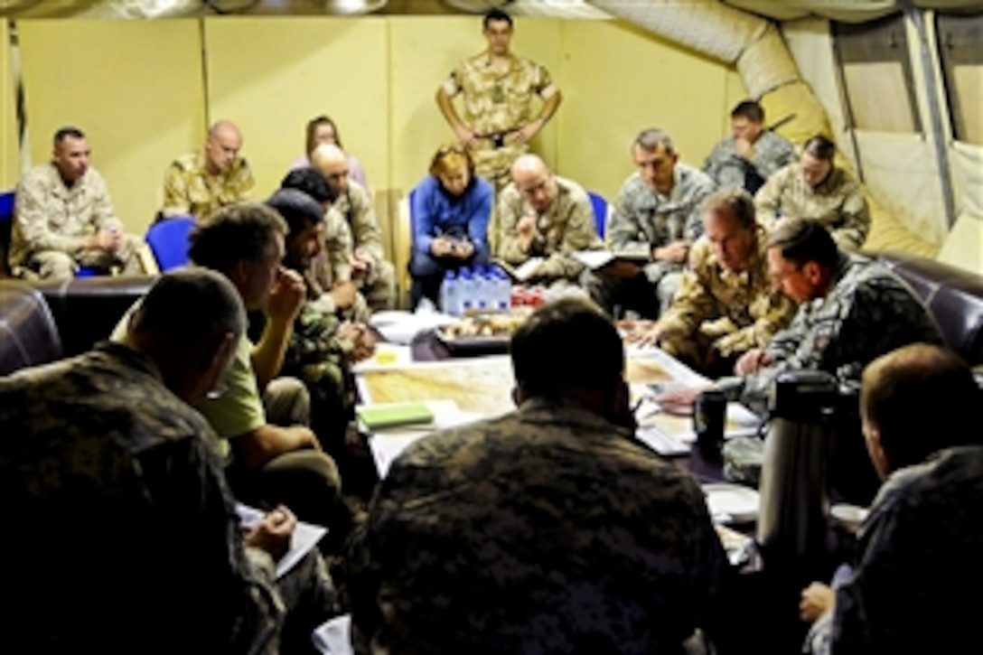 U.S. Army Gen. David H. Petraeus, right, commander of the International Security Assistance Force,  meets with U.K. Brig. Gen. George Norton, deputy commander of the 4th Mechanised Brigade, to discuss recent partnerships with the Afghanistan government and security forces during a visit to Regional Command Southwest in Kabul, Afghanistan, Sept. 23, 2010.