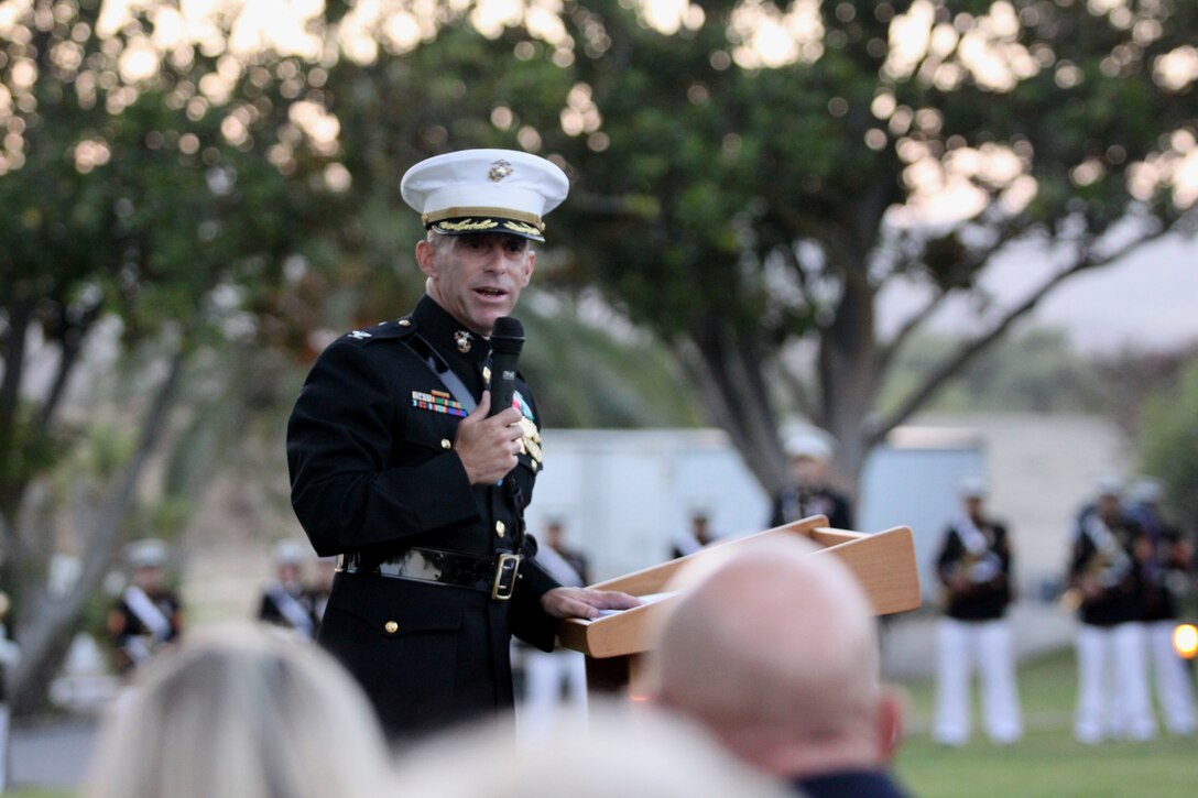 Col. Nicholas F. Marano, commanding officer, Marine Corps Base Camp Pendleton, speaks to more than 100 service members, family and distinguished guests who are gathered for an evening colors ceremony in celebration of Camp Pendleton’s 68th anniversary at the historic Santa Margarita Ranch House, Sept. 23. Marano illustrated how much the base has progressed in the last 68 years. Following his closing remarks, the color guard retired the American and Marine Corps flags at sunset to the sounds of the 1st Marine Division band.