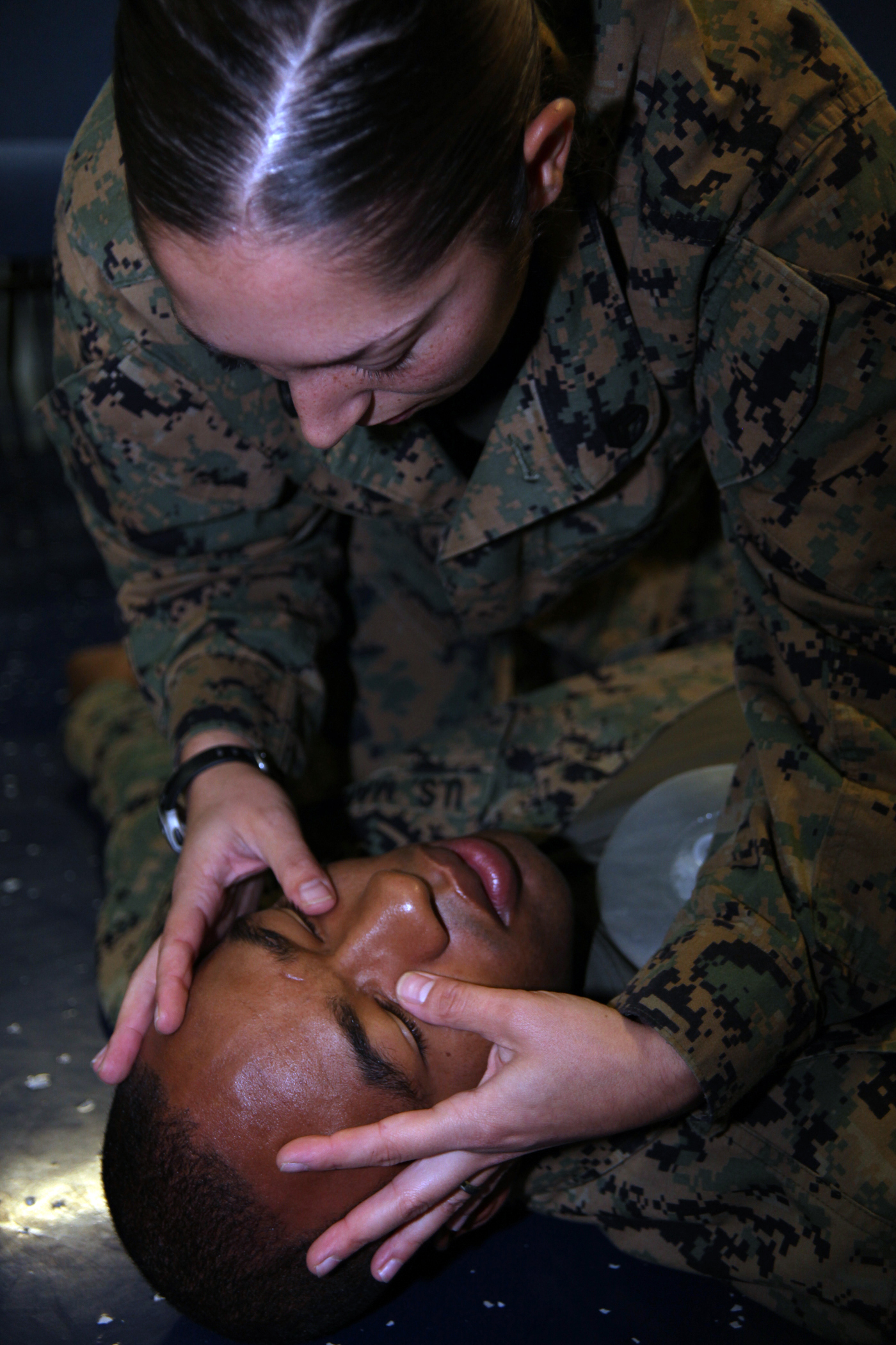 Staff Sgt. Leah G. Dorley, native of Hazel Park, Mich., and embarkation chief with Marine Air Control Squadron 2, checks for head injuries on Sgt. Xavier W. Wethington, a simulated casualty and native of Brunswick, Ga., during a casualty assessment test of the Combat Life Saver training aboard the USS Iwo Jima, Sept. 24, 2010. Marines with MACS-2, Command Element of Special-Purpose Marine Air-Ground Task Force Continuing Promise 2010 participated in the five-day training while operating off the coast of Bluefields, Nicaragua, during their four-month deployment to the Caribbean, Central and South America.