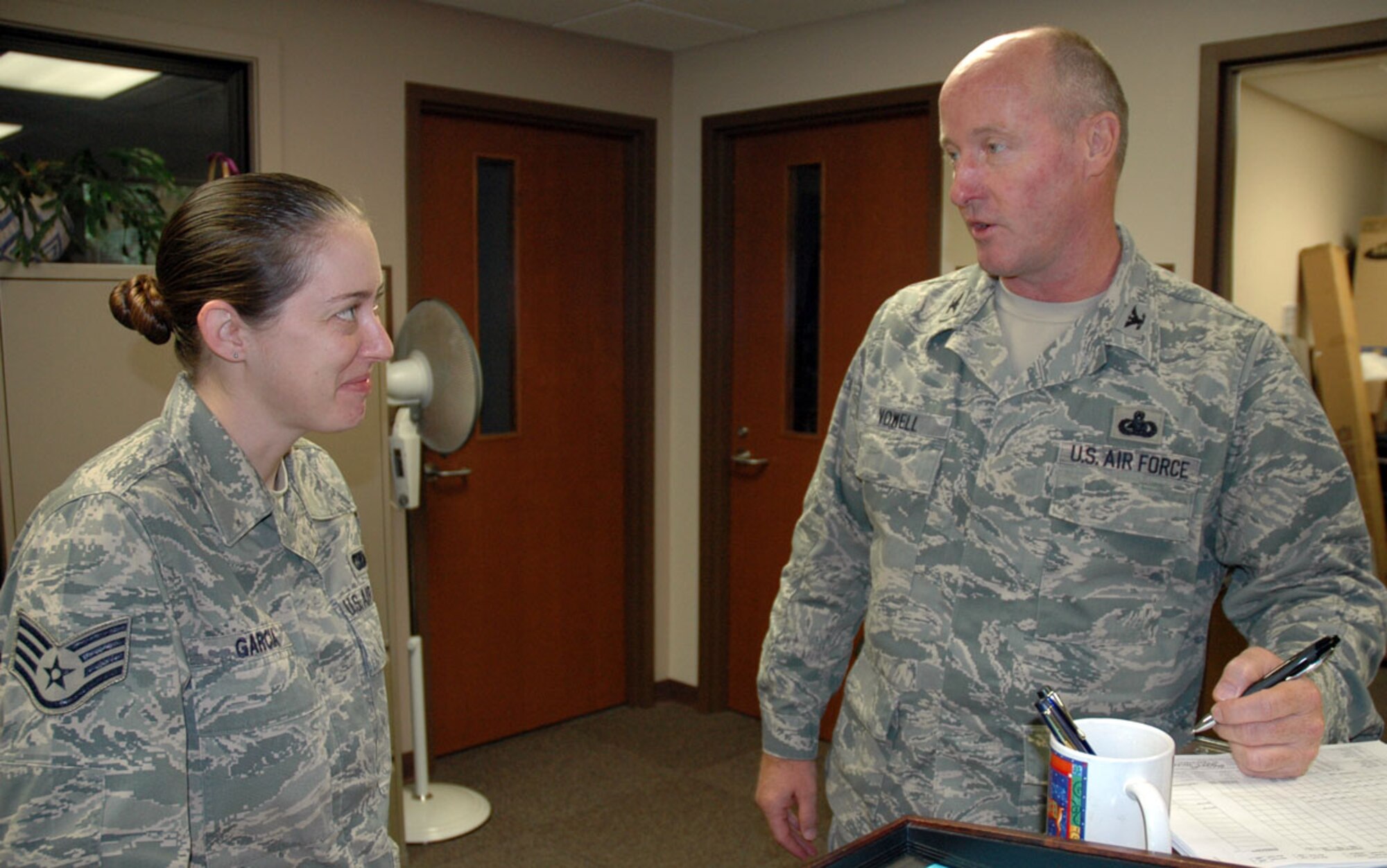 JOINT BASE LEWIS-MCCHORD, Wash. -- Col. Gerald Vowell, 446th Mission Support Group commander, draws a smile from his executive assistant, Staff Sgt. Jamie Garcia, during a one-on-one here Sept. 24. Colonel Vowell took over as the group commander earlier this month, replacing Col. Craig Petersen, who is now the commander of the 433rd MSG at Lackland Air Force Base, Texas.  This is Colonel Vowell's third assignment to the Pacific Northwest base in a career that began at McChord Air Force Base some 36 years ago. (U.S. Air Force photo/Staff Sgt. Grant Saylor)