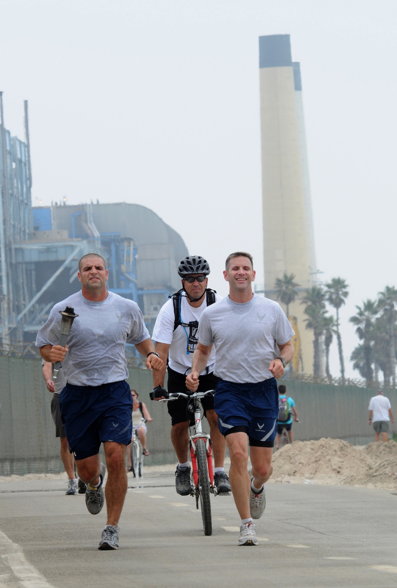 Runners pass by the power plant and beach in El Segundo on the way to Los Angeles AFB during the 24-hour POW-MIA relay, Sept. 16.  Runners traveled 21 miles from Fort MacArthur in San Pedro to Los Angeles Air Force Base in El Segundo. The relay lasted 24-hours with personnel running through the night around the base's track. (Photo by Joe Juarez)