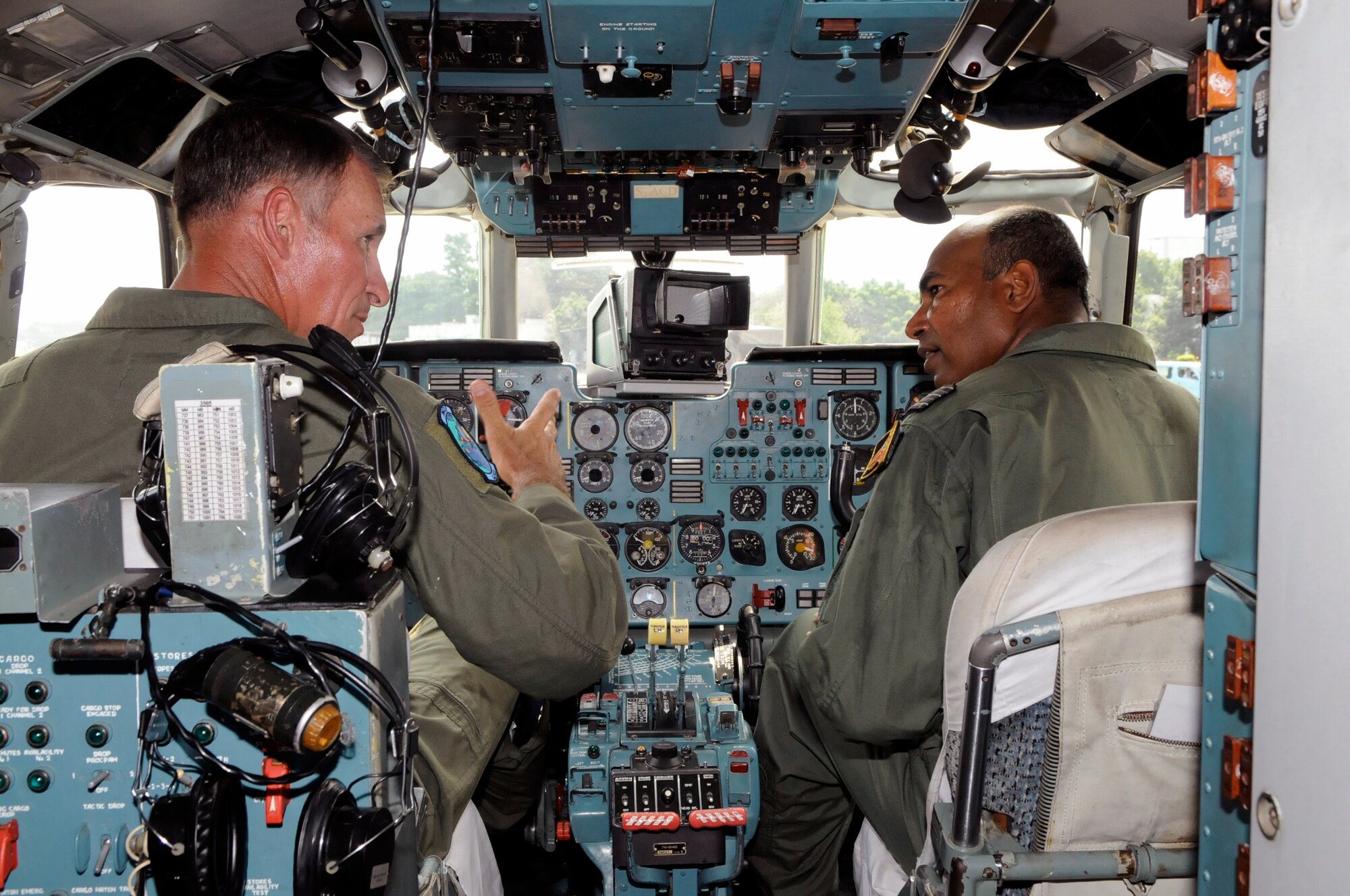 Brig. Gen. Michael Keltz discusses the differences between the C-130 Hercules and AN-32 aircraft with Bangladesh Wing Commander Imran while in an AN-32 cockpit at the close of exercise Cope South 10, Sept. 23, 2010, in Bangladesh. The exercise offered 40 Airmen from Yokota Air Base, Japan, the opportunity to exchange airlift, air land and airdrop delivery techniques with the Bangladesh air force. Two C-130s from Yokota Air Base, Japan, and an AN-32 from Kurmitola Air Base participated in Cope South 10. General Keltz is the Pacific Air Forces director of operations, plans, programs and requirements at Joint Base Pearl Harbor Hickam, Hawaii.  (U.S. Air Force photo/Master Sgt. Jeff Loftin) 