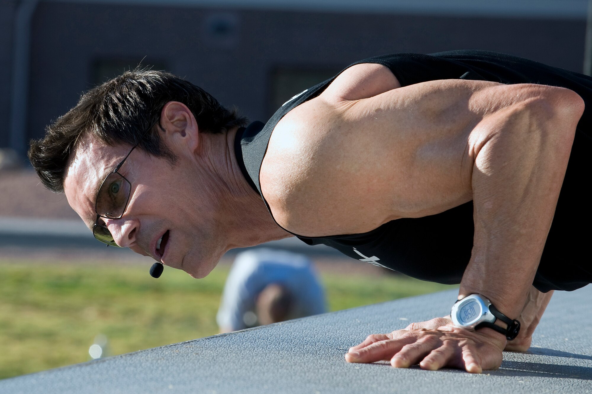 NELLIS AIR FORCE BASE, Nev.-- Fitness trainer Tony Horton conducts a push-up exercise at the Nellis Sports Pavilion, Sept. 24. Mr. Horton developed a fitness system which is used by military members from around the world. (U.S. Air Force photo by Senior Airman Brett Clashman/Released)
