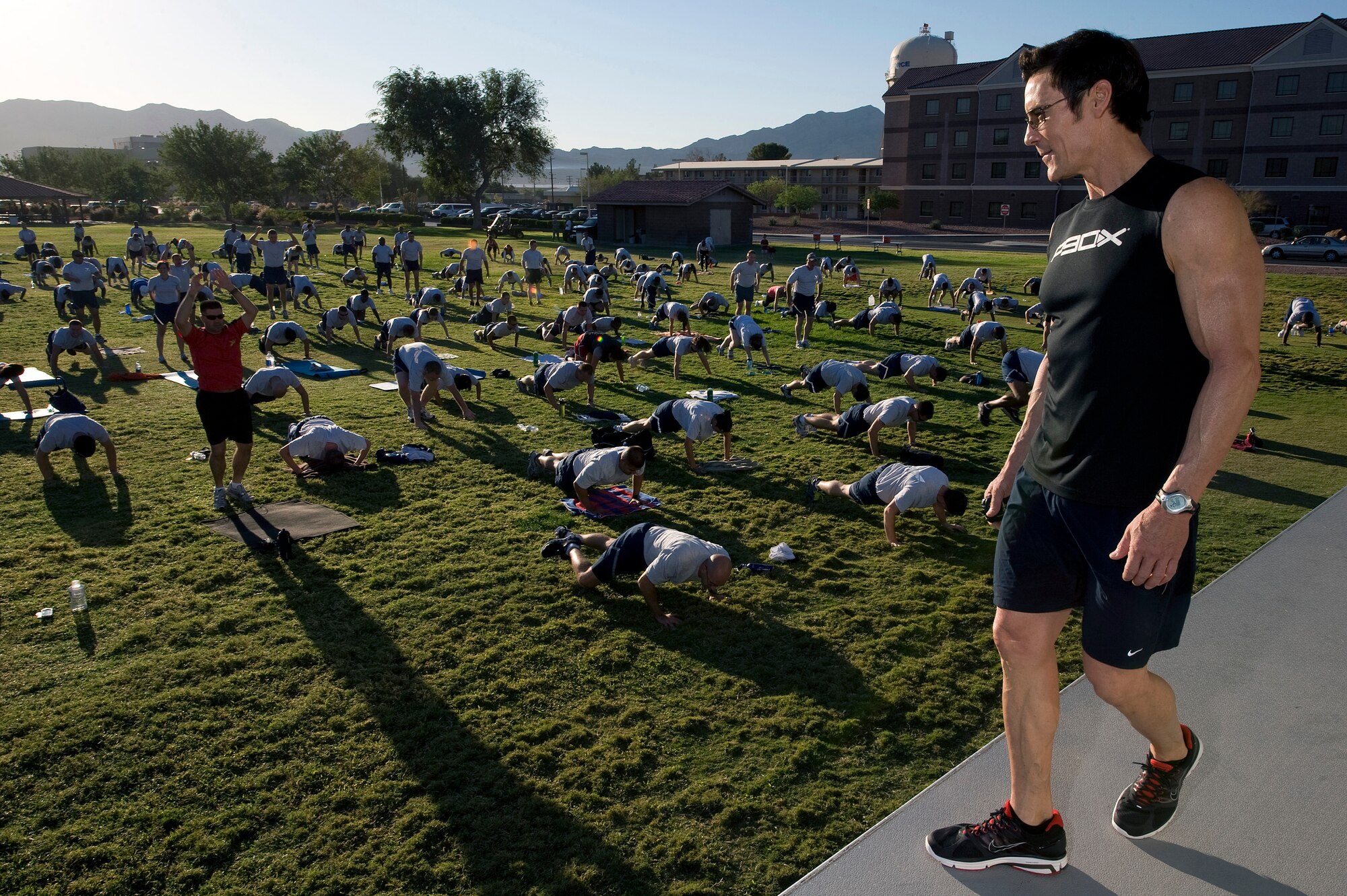 NELLIS AIR FORCE BASE, Nev.-- Fitness trainer Tony Horton conducts a push-up exercise at the Nellis Sports Pavilion, Sept. 24. Mr. Horton developed a fitness system which is used by military members from around the world. (U.S. Air Force photo by Senior Airman Brett Clashman/Released)
