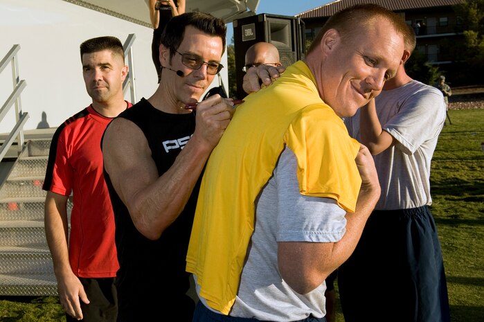 NELLIS AIR FORCE BASE, Nev.-- Tony Horton, a nationally-recognized fitness trainer, signs autographs for fans at the Nellis Sports Pavilion, Sept. 24. Mr. Horton developed a fitness system used by military members from around the world. (U.S. Air Force photo by Senior Airman Brett Clashman/Released)
