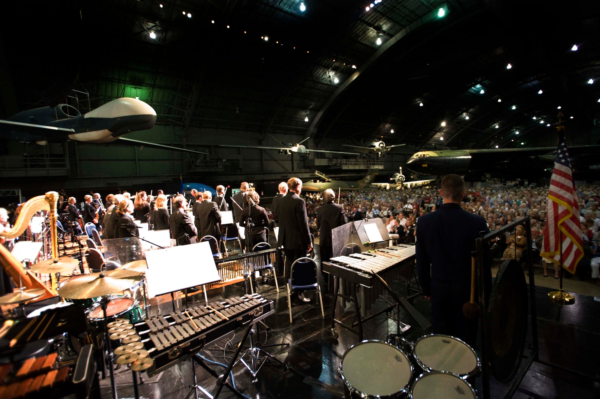 USAF Band of Flight on stage with the Dayton Philharmonic Orchestra for a Patriot Day concert at the National Museum of the United States Air Force.