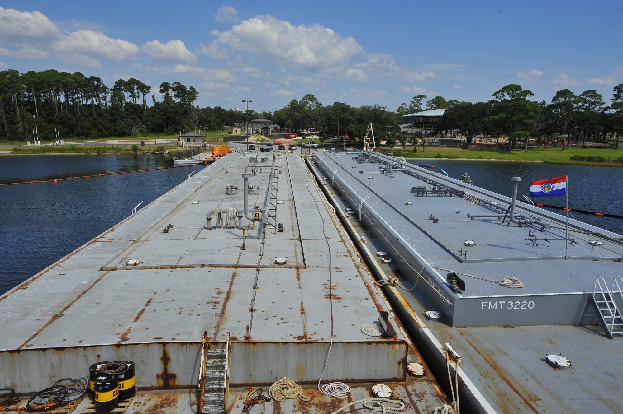 Two fuel tankers dock at the Sound at Hurlburt Field, Fla., Sept. 17, 2010.  The 1st Special Operations Logistics Readiness Squadron received neary half a million gallons of jet fuel delivered by the barge for the first time since October 2009. (DoD photo by U.S. Air Force Senior Airman Sheila deVera) (RELEASED)
