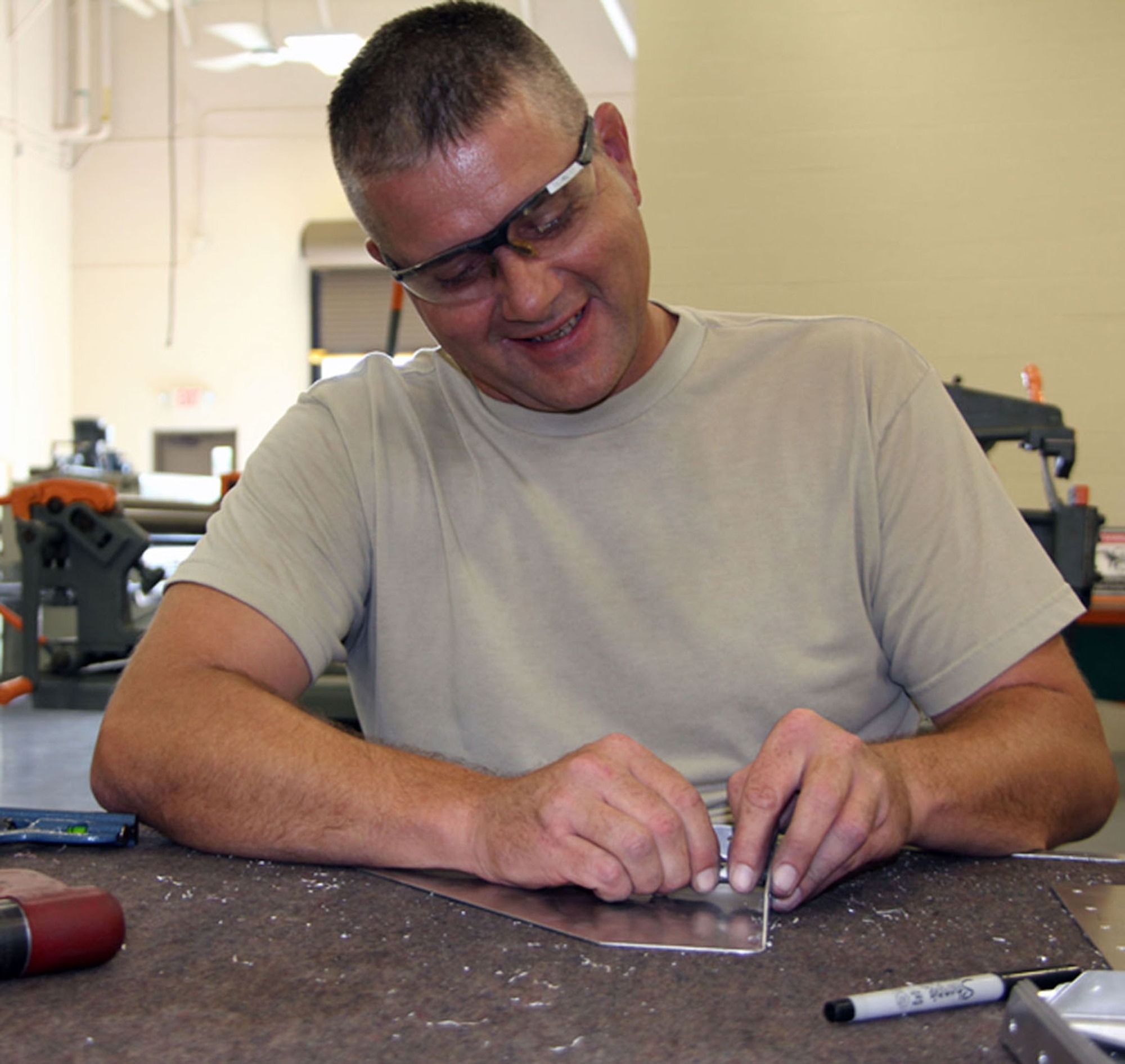 Staff Sgt. Chris Frye is building several shadow boxes that will hold maintenance technical order manuals.  Sergeant Frye is assigned to the sheet metal shop of the 932nd Maintenance Squadron at Scott AFB. (U.S. Air Force photo/Tech. Sgt. Dan Oliver)
