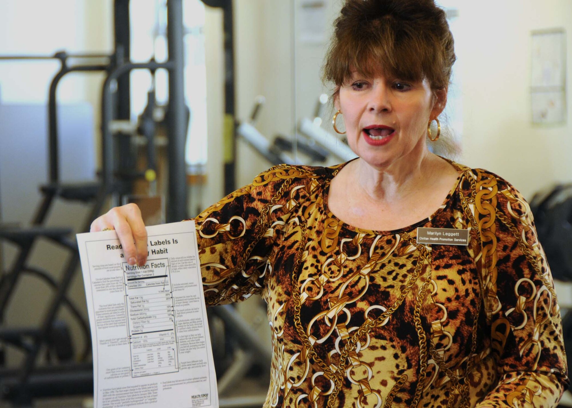 Marilyn Leggett, Health Promotion Coordinator from Eglin Air Force Base’s Health and Wellness Center, holds an example nutrition guide during a class on nutrition and eating habits for members at the Duke Field fitness center Sept. 24.  Ms. Leggett held classed at the fitness center to give reservists and civilian employees information on reading nutrition labels, mindful eating habits and learning to modify recipes to make them a more healthy choice.  (U.S. Air Force photo/Staff Sgt. Jonathan McCallum)