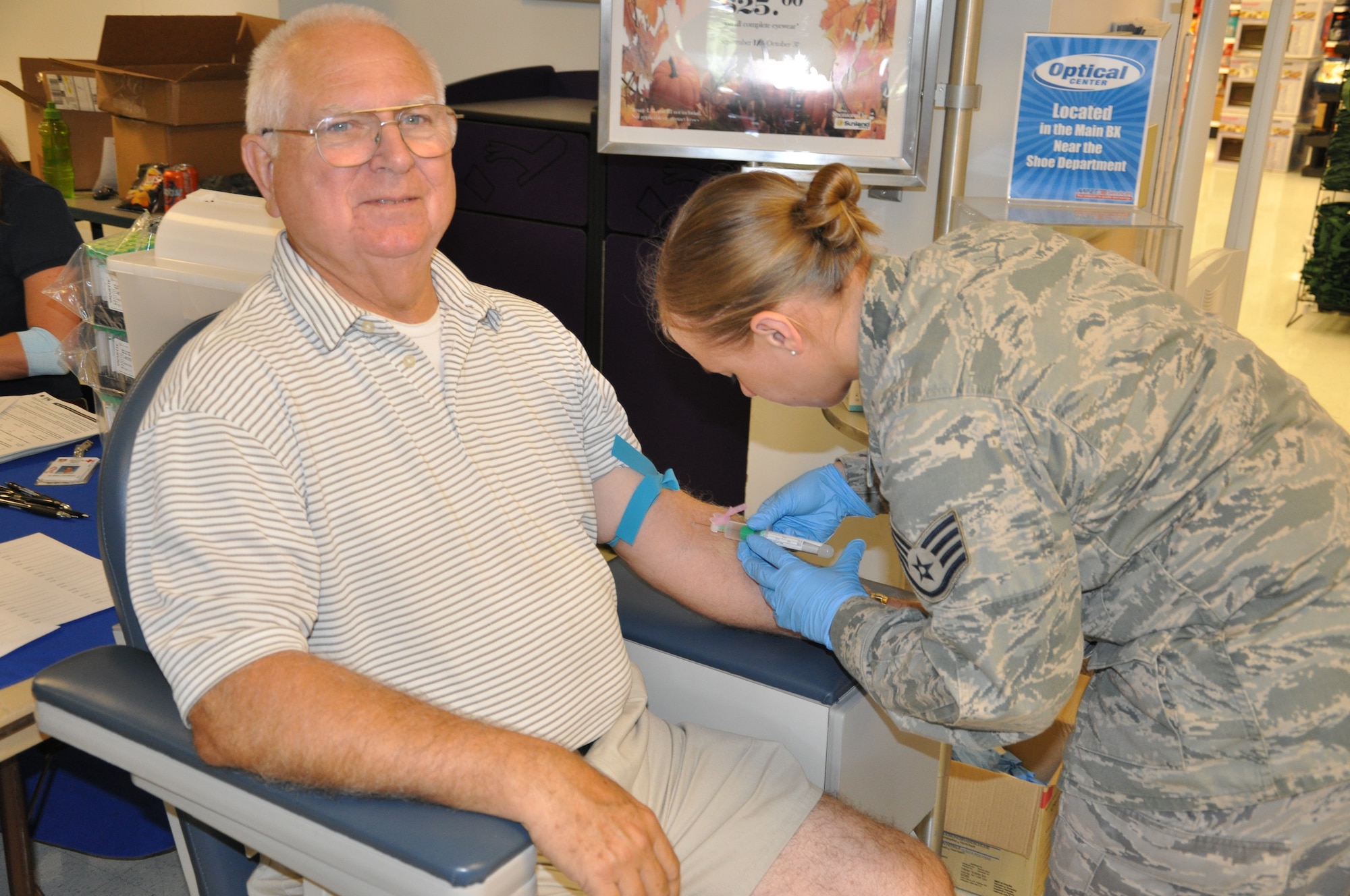 Retired Senior Master Sgt. Robert Young gets his blood drawn by Staff Sgt. Alissa Leviskia, 1st Special Operations Medical Operations Squadron medical technician, for a complimentary cholesterol check during the 1st Special Operations Wing Commander’s Retiree Appreciation Day at the base exchange at Hurlburt Field, Fla., Sept. 17, 2010. The Hurlburt Field Retiree Activities Office partnered with several organizations to show their appreciation during the weekend of the Air Force’s 63rd birthday. (DoD photo by U.S. Air Force Airman 1st Class Joe McFadden) (RELEASED)