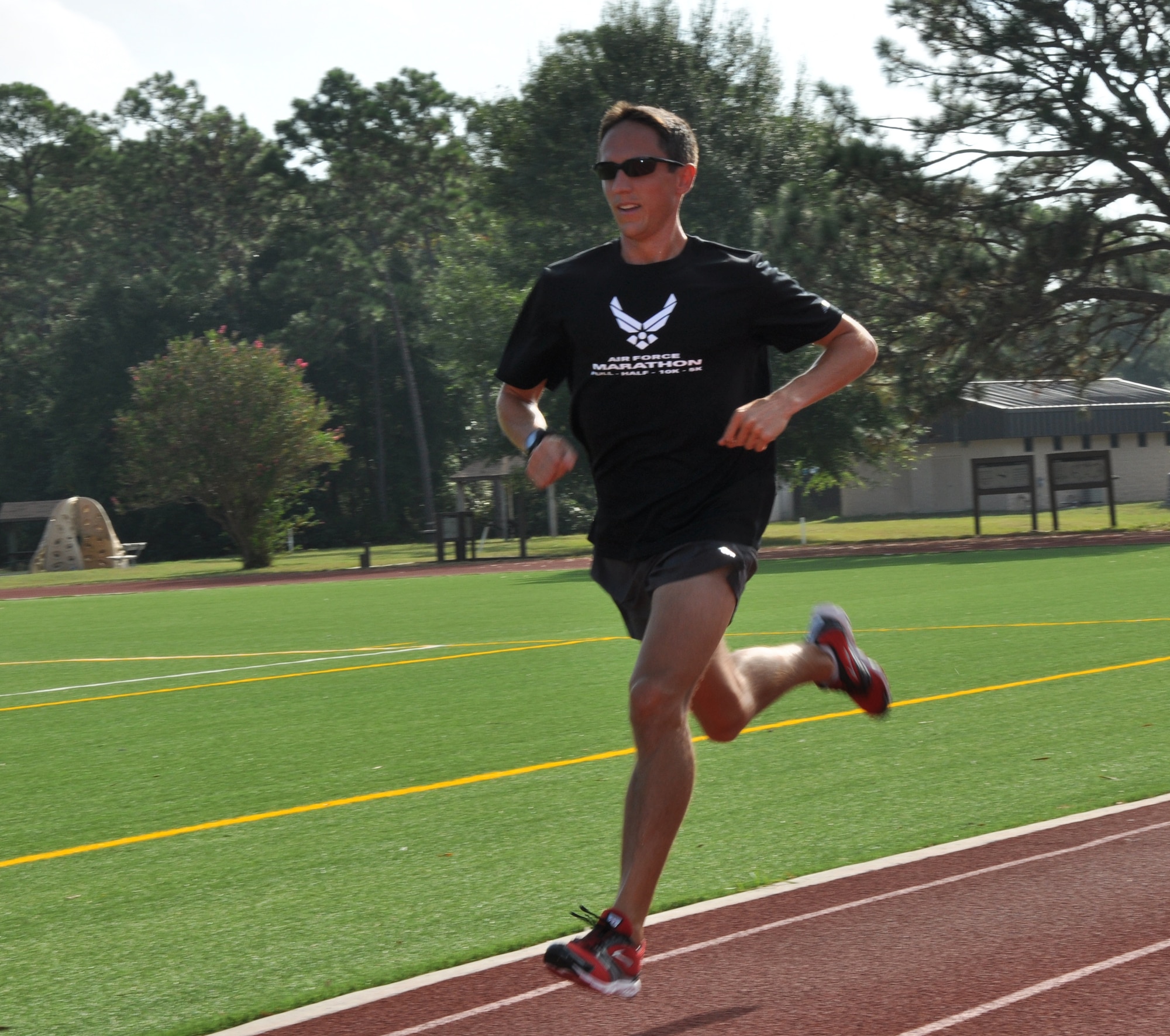 Capt. Ben Payne, 34th Special Operations Squadron pilot, runs a lap around the track at the Aderholt Fitness Center at Hurlburt Field, Fla., Sept. 24, 2010. Captain Payne finished first in the men's half marathon during the 2010 Air Force Marathon at Wright-Patterson Air Force Base, Ohio, Sept. 17-18. (DoD photo by U.S. Air Force Airman 1st Class Joe McFadden) (RELEASED)