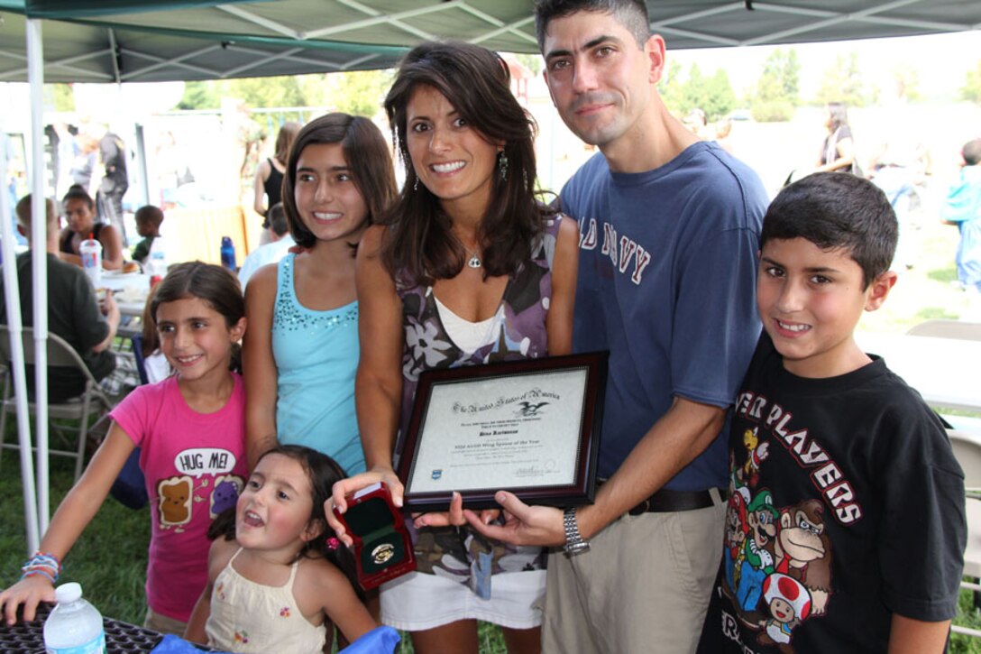 Dina Kartsonas was named Spouse of the Year for the 932nd Airlift Wing. Other family members are Maj.Gus Kartsonas and their children. (U.S. Air Force photo/by Tech. Sgt. Oliver)