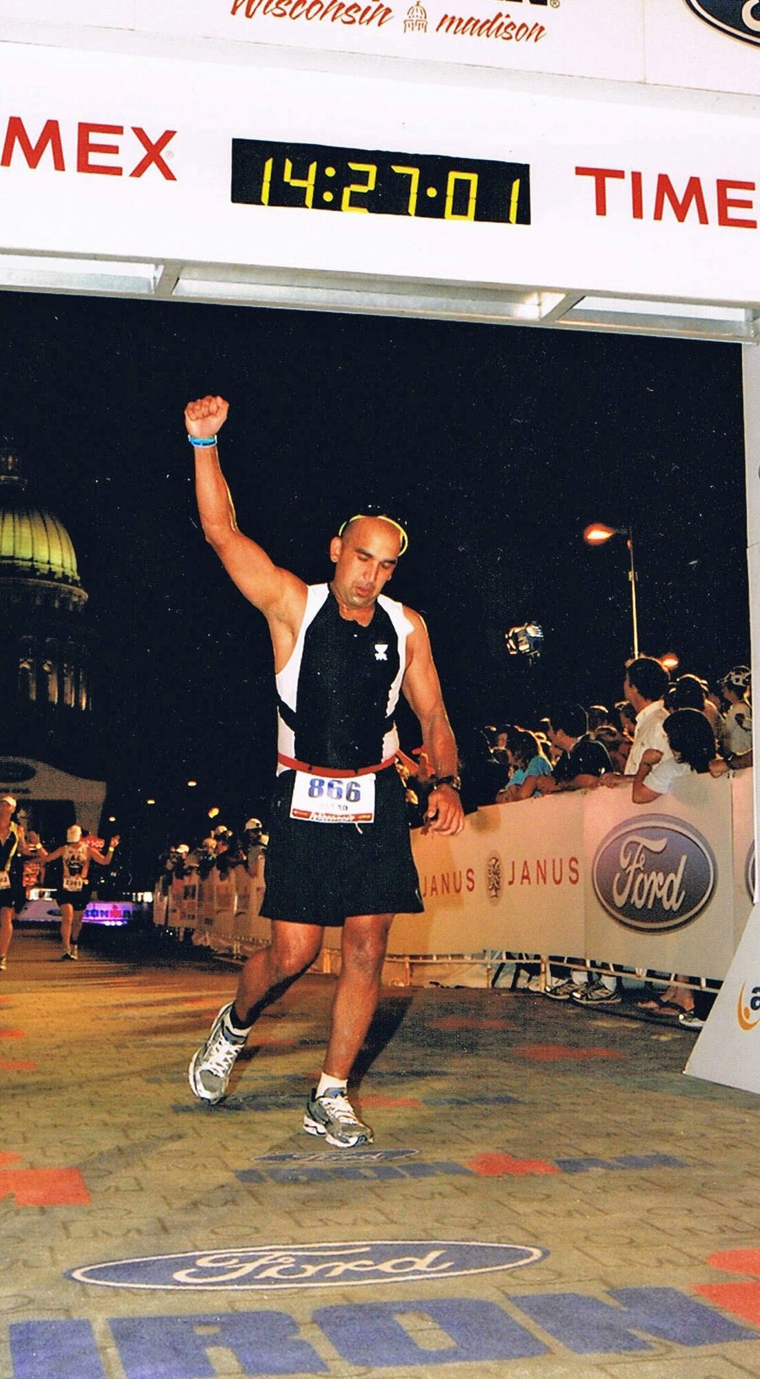MADISON, Wisc. – Maj. Assad Samad, 10th Space Warning Squadron operations officer, crosses the finish line at Ford’s 2010 Ironman competition. (Courtesy photo)
