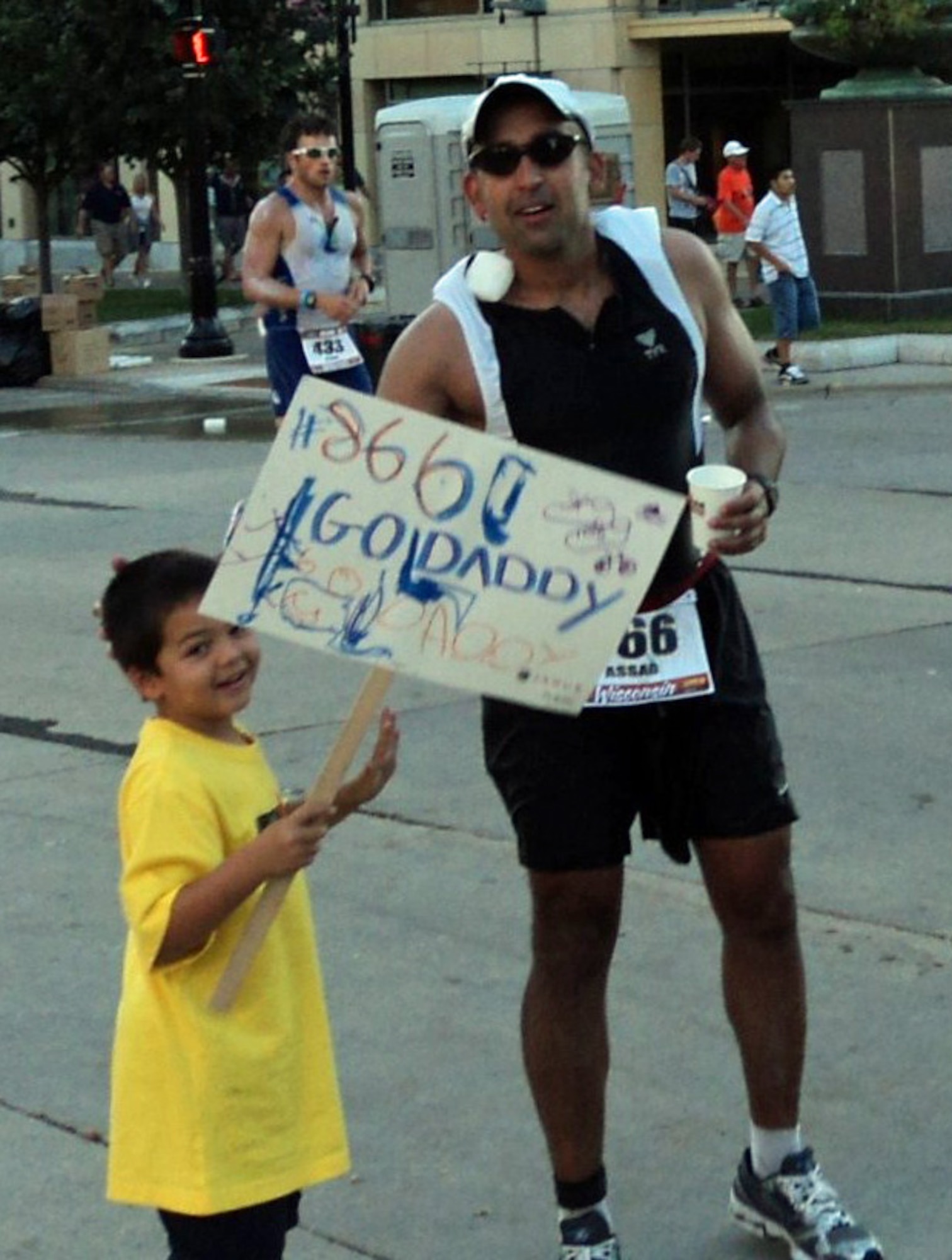 MADISON, Wisc. – Major Assad Samad, 10th Space Warning Squadron operations officer, receives support from his son Kaiden during the running portion of the Ironman competition. He completed the 26.2 mile run in 5 hours and 24 minutes. (Photo courtesy Ginette Samad) 