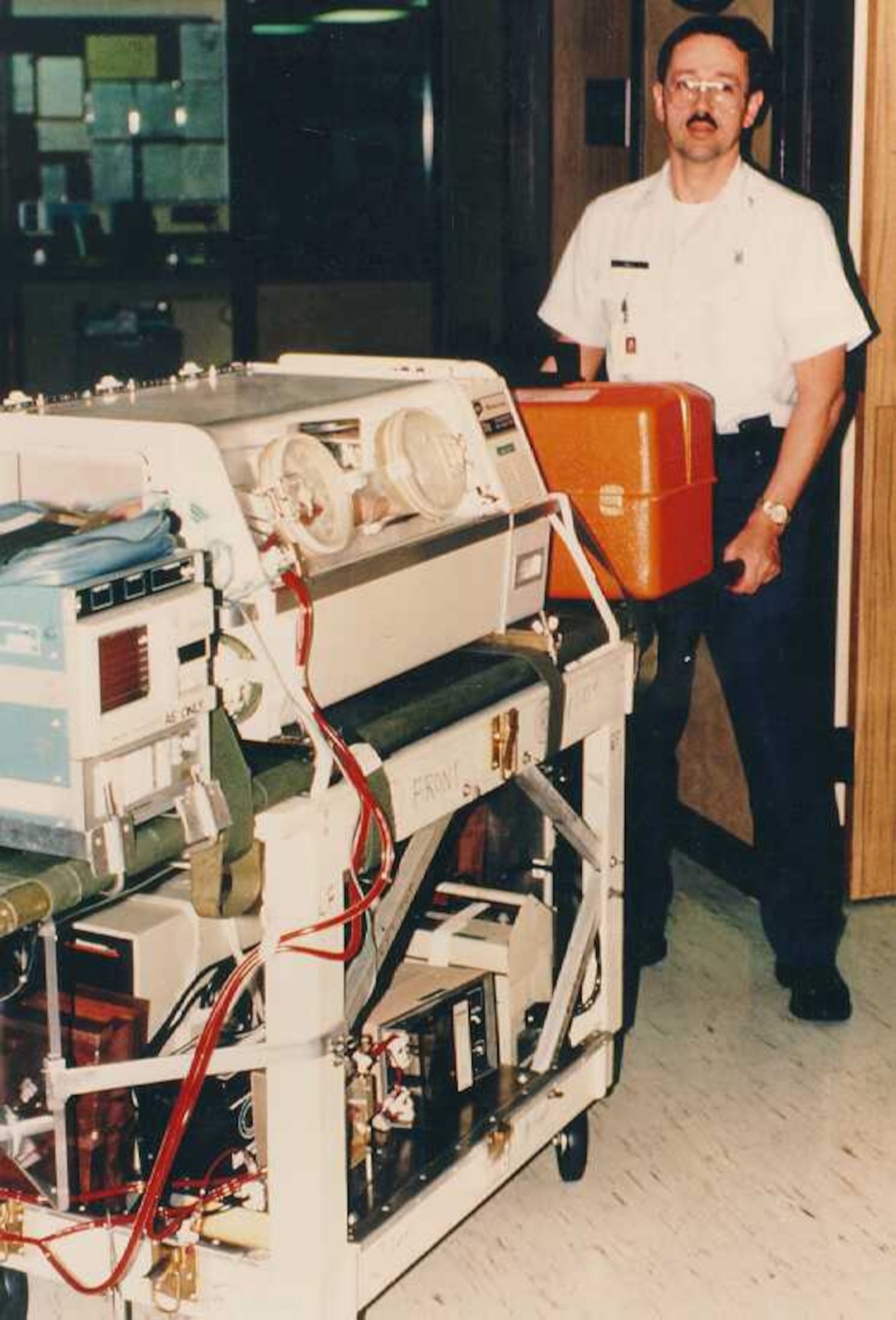 Dr. Donald Null, Extra-Corporeal Membrane Oxygenation staff, demonstrates the use of a first-generation ECMO cart. Today, ECMO carts are considered third-generation and are capable of serving adults with more modern and advanced equipment. (Courtesy photo/Released)