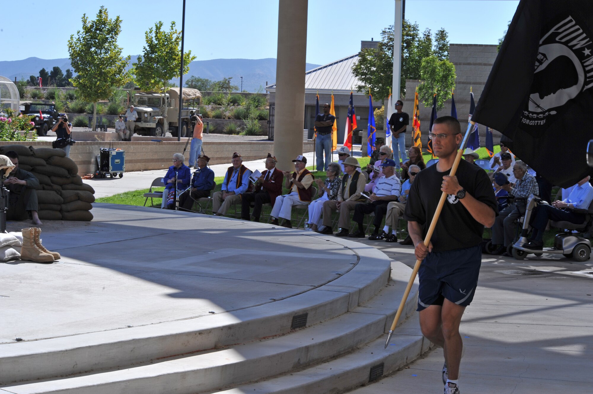 Capt. Benjamin Washburn, 377th Security Forces Squadron, delivers the POW/MIA flag to the New Mexico Veterans Memorial Sept. 17 to begin the National POW/MIA Recognition Day ceremony.  U.S. Air Force Photo by Elizabeth Martinez