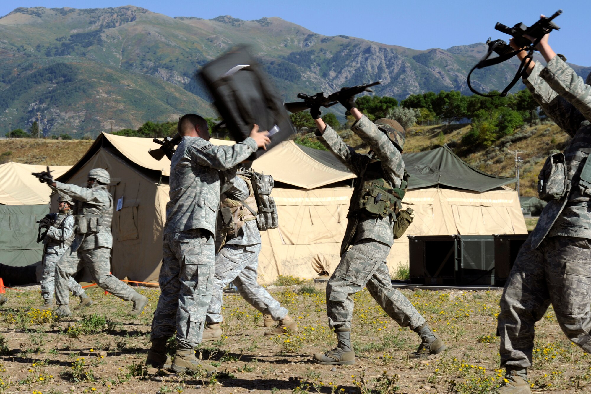 Senior Airman Stephany Miller uses her rifle to defend an attack while attending combat readiness training at Hill Air Force Base, Utah, Sept. 13, 2010. Airmen Miller is a combat photographer with the 2nd Combat Camera Squadron who is assigned to the 75th Security Forces as an augmentee.  (U.S. Air Force photo/Staff Sgt. Renae Saylock)
