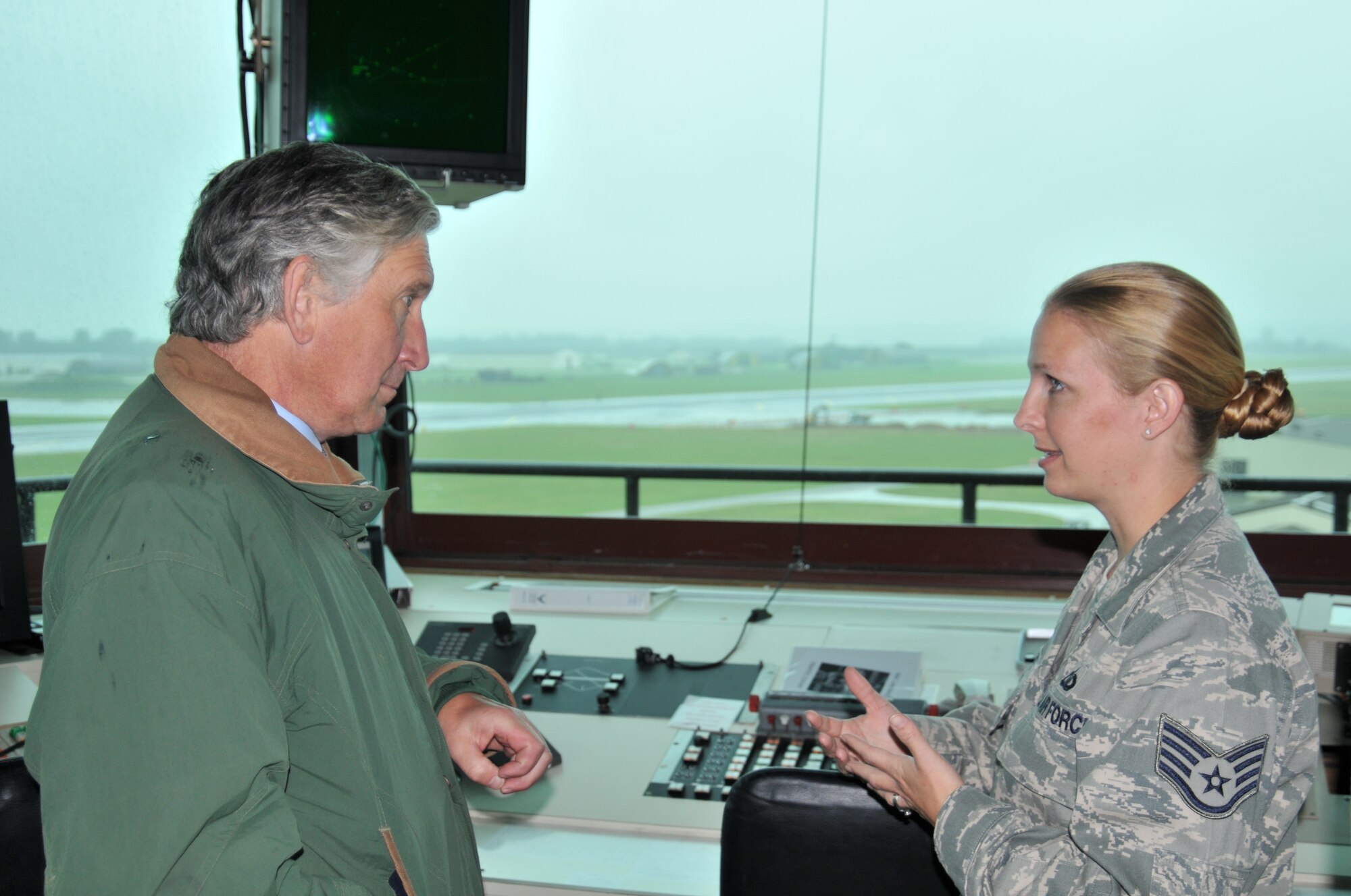High Sheriff of Norfolk Charles Barratt speaks with Staff Sgt. Crystal Aponte, 48th Operational Support Squadron Air Tower Control tower watch supervisor, in the control tower on RAF Lakenheath, England, Sept. 24. Mr. Barratt visited Lakenheath to familiarize himself with the 48th Fighter Wing’s mission and its contributions to the community. (U.S. Air Force photo/Senior Airman David Dobrydney)
