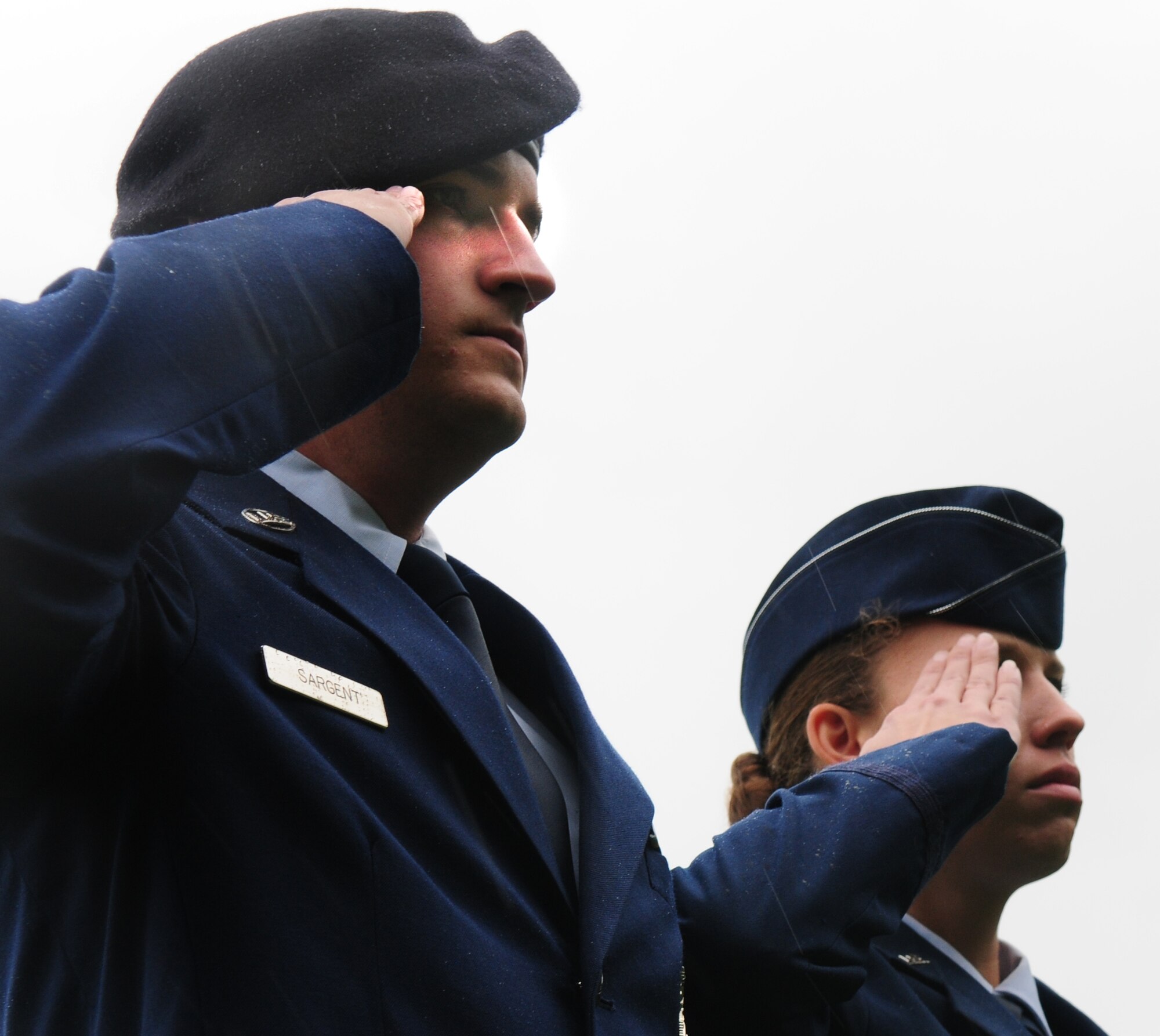 SPANGDAHLEM AIR BASE, Germany – Senior Airman Matthew Sargent, 52nd Security Forces Squadron, renders a salute in the rain at the closing of the prisoner of war missing in action ceremony Sept. 24. Sabers gathered to honor and pay tribute to fellow servicemembers and their families. (U.S.  Air Force photo/Staff Sgt. Heather M. Norris)