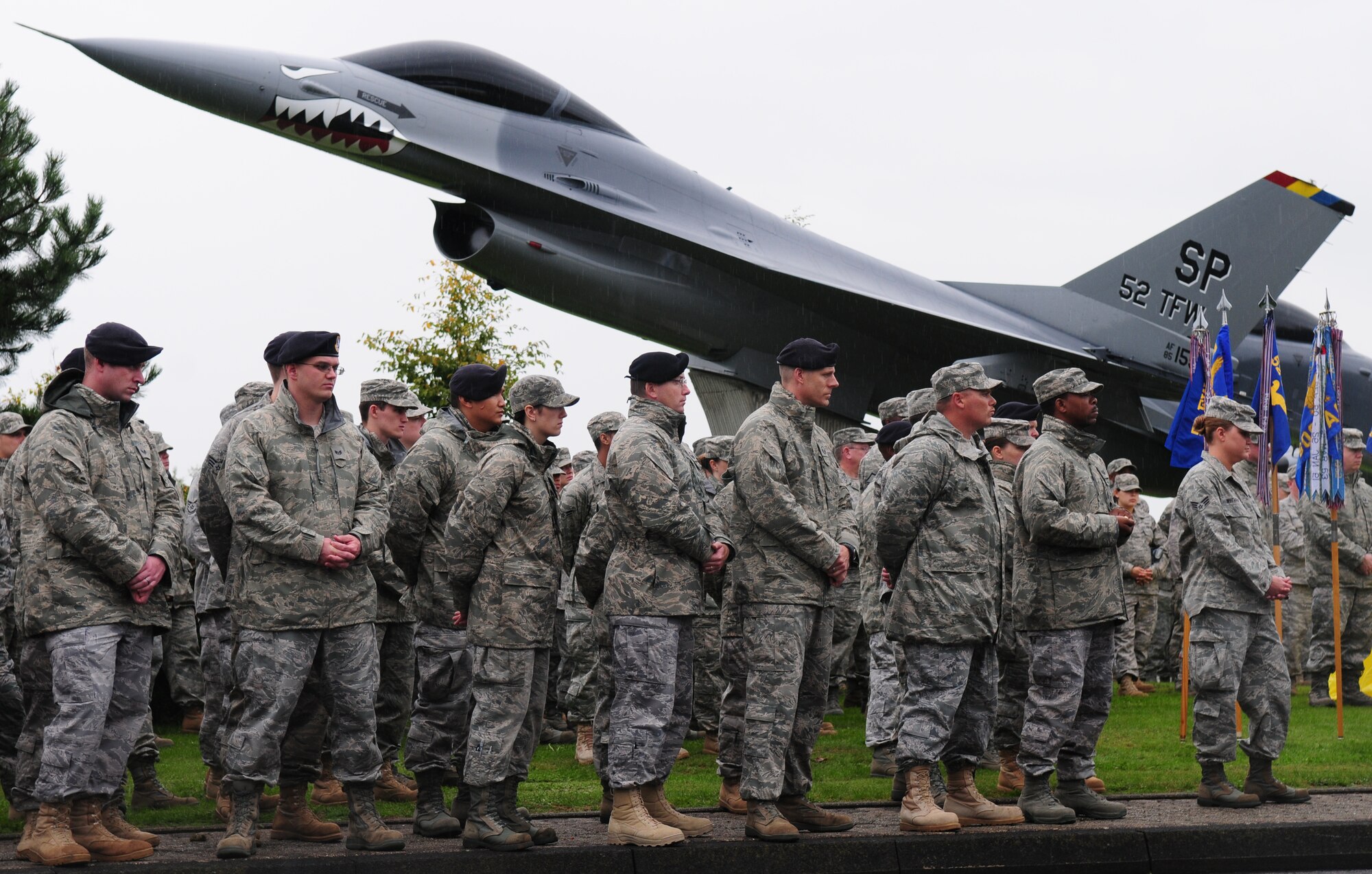 SPANGDAHLEM AIR BASE, Germany – Sabers gather to pay tribute to fellow servicemembers at the prisoner of war missing in action ceremony Sept. 24. Despite the rain, a crowd gathered for opening remarks by Col. Christopher Weggeman, 52nd Fighter Wing commander. (U.S.  Air Force photo/Staff Sgt. Heather M. Norris)