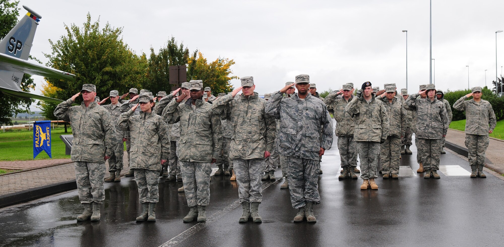 SPANGDAHLEM AIR BASE, Germany – The flights of Airman Leadership School class 10-8 render salutes during the National Anthem at the beginning of the prisoner of war missing in action ceremony Sept. 24.  The ceremony honored servicemembers and paid tribute to families for their sacrifices for their country. (U.S. Air Force photo/Staff Sgt. Heather M. Norris)